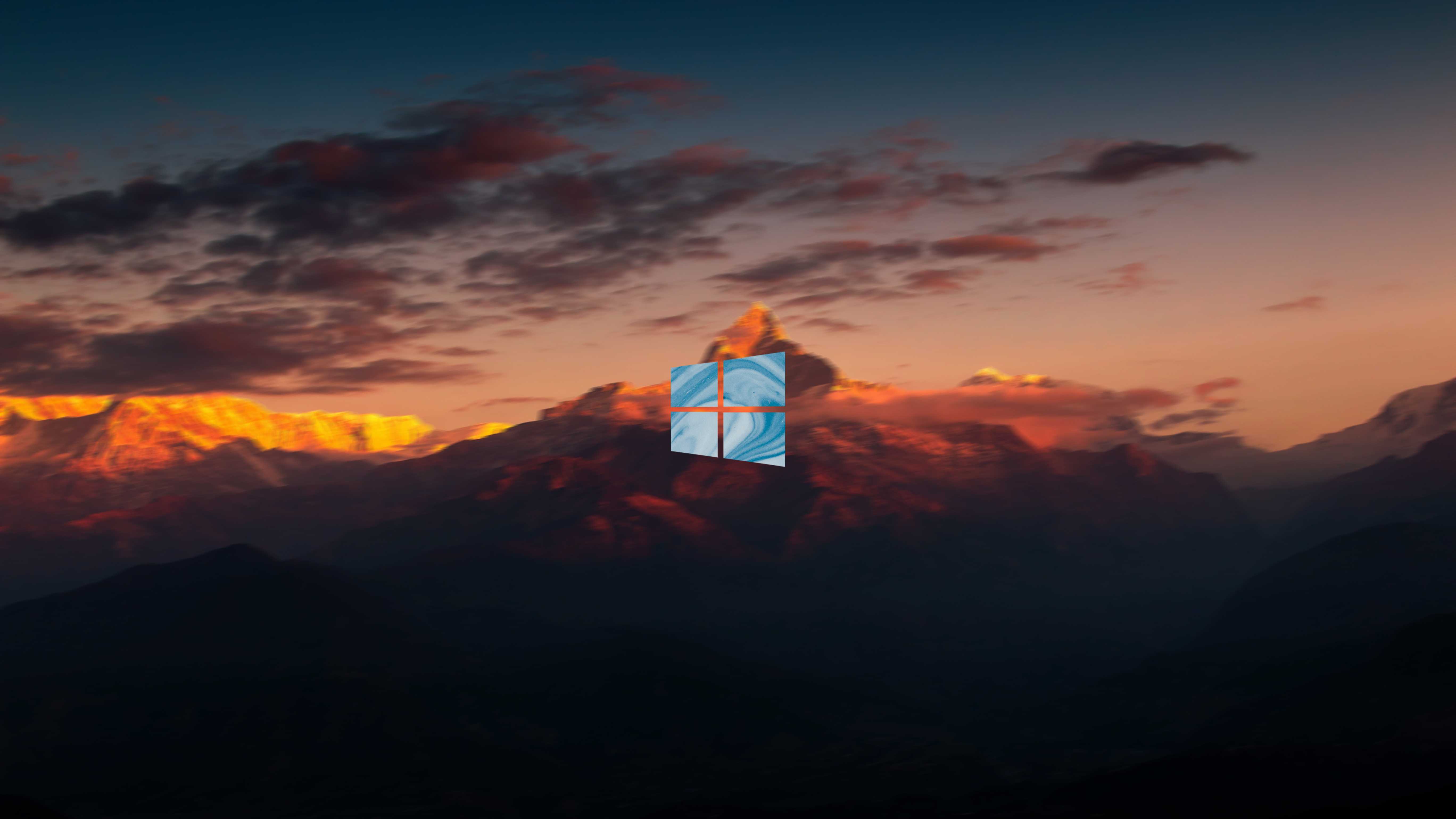 4K Microsoft Windows logo over mountains at sunset HD Wallpaper