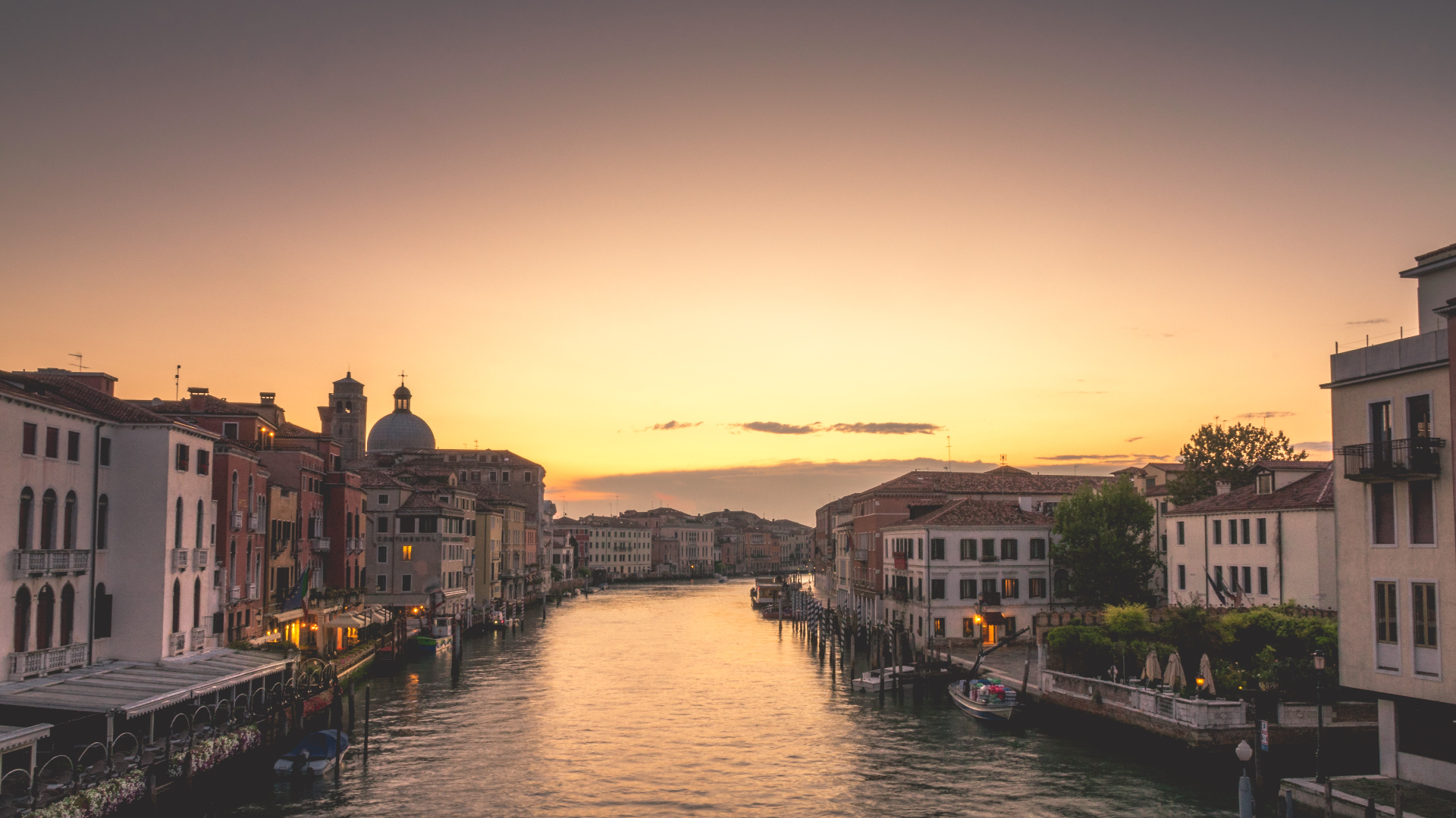 Venice canal at sunset with boats and buildings HD Wallpaper