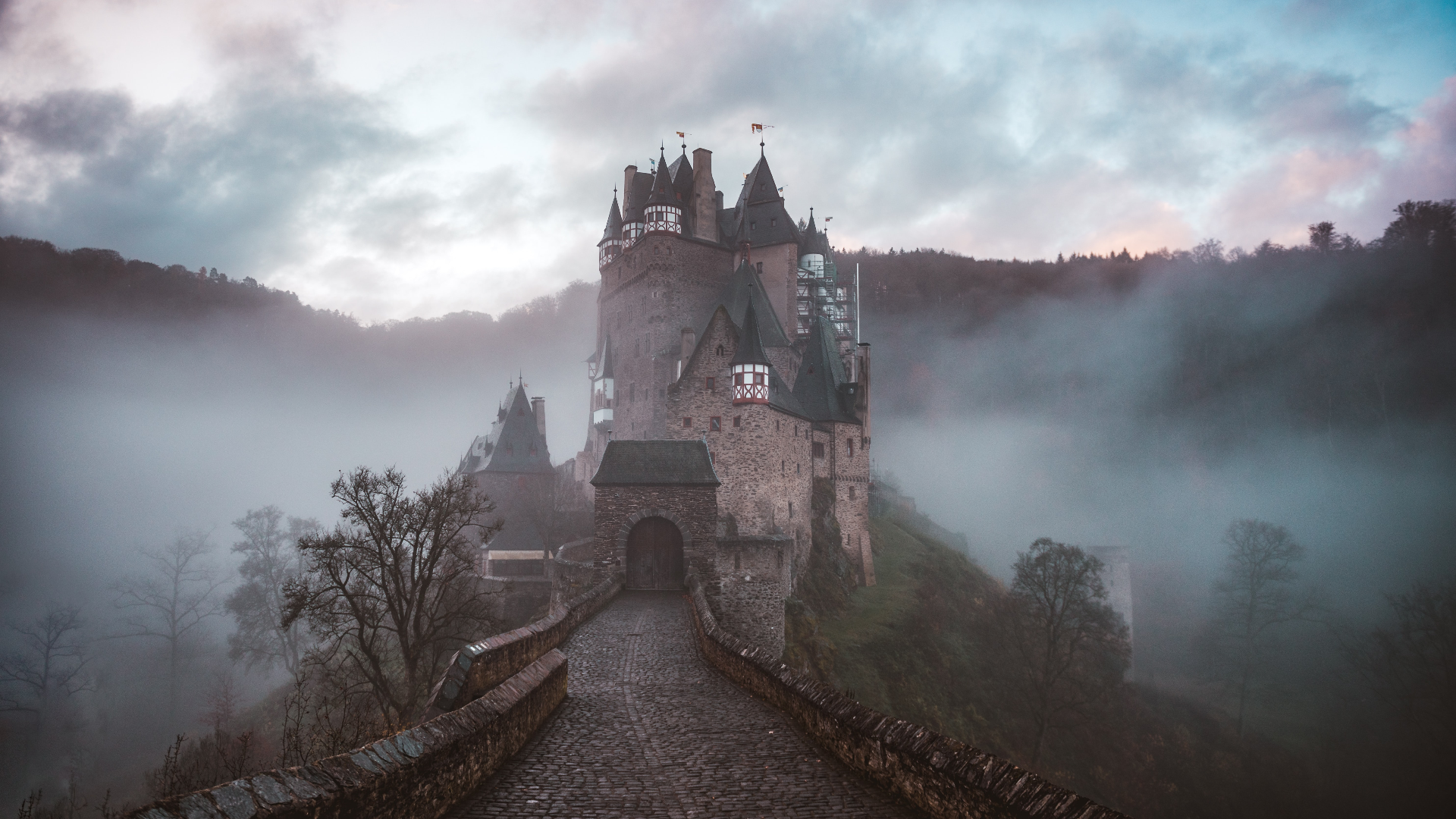 Eltz Castle in Germany shrouded in mist at dawn HD Wallpaper
