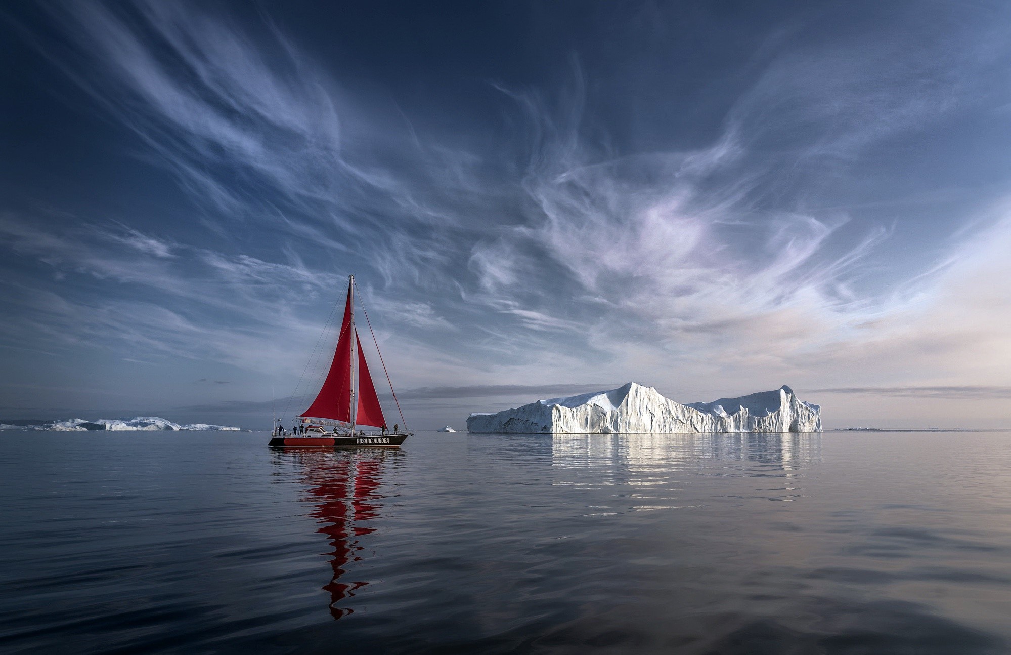 Red sailboat near icebergs in the Arctic HD Wallpaper