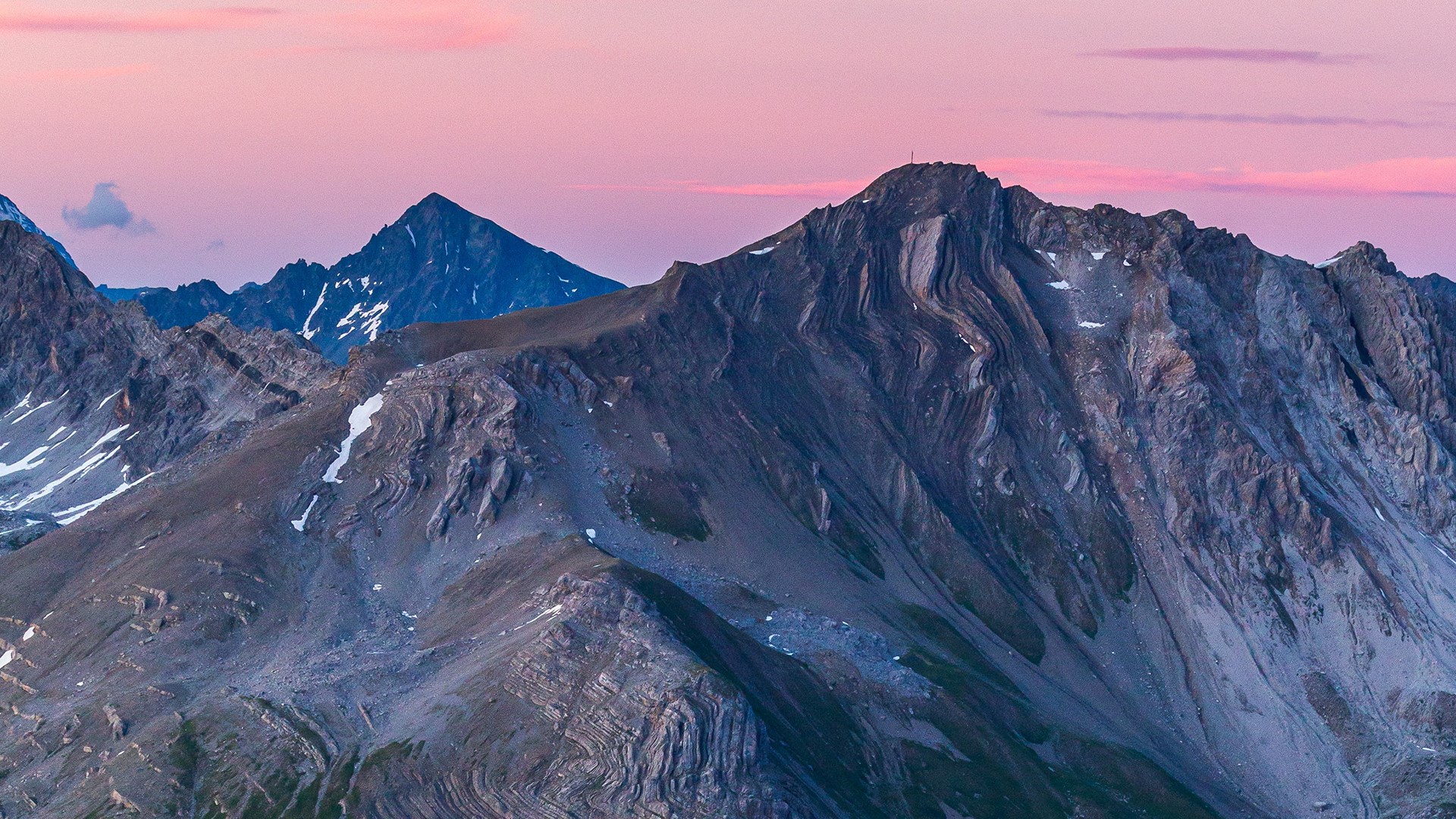 Mountains under a pink sky at sunset HD Wallpaper