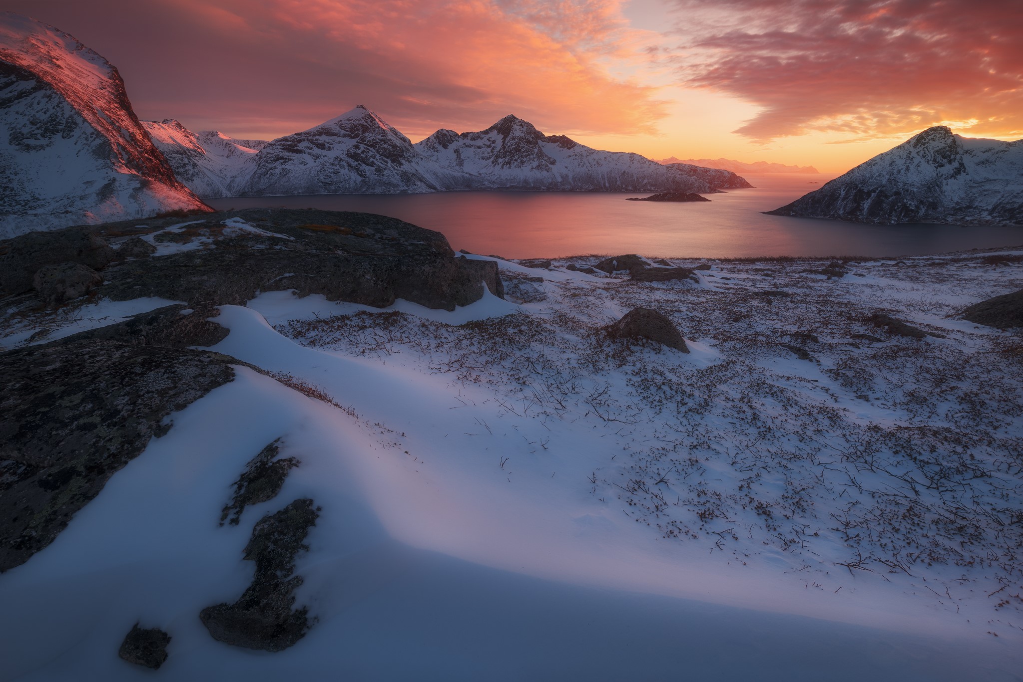 Snowy mountains and water at sunset HD Wallpaper
