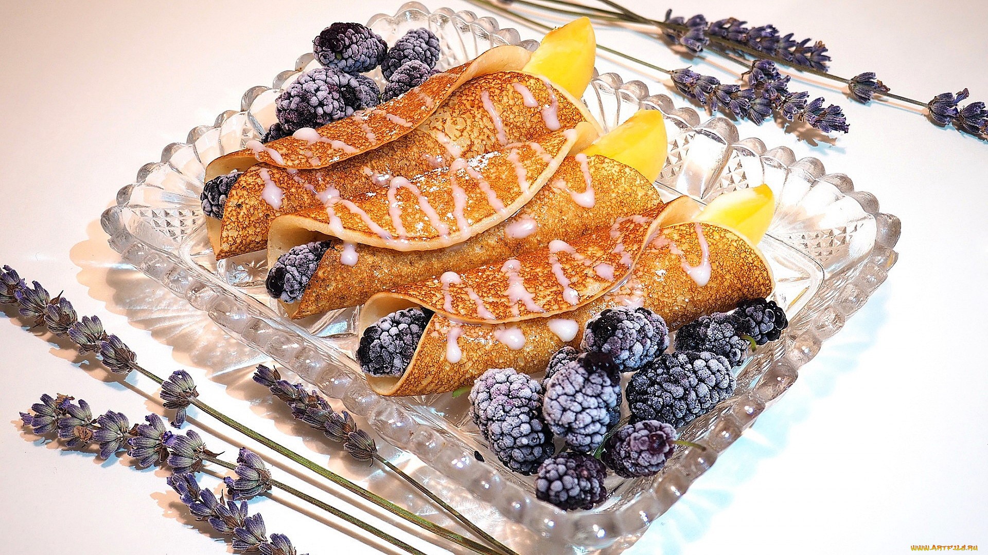 Crepes with blackberries and lemon slices on a glass plate HD Wallpaper