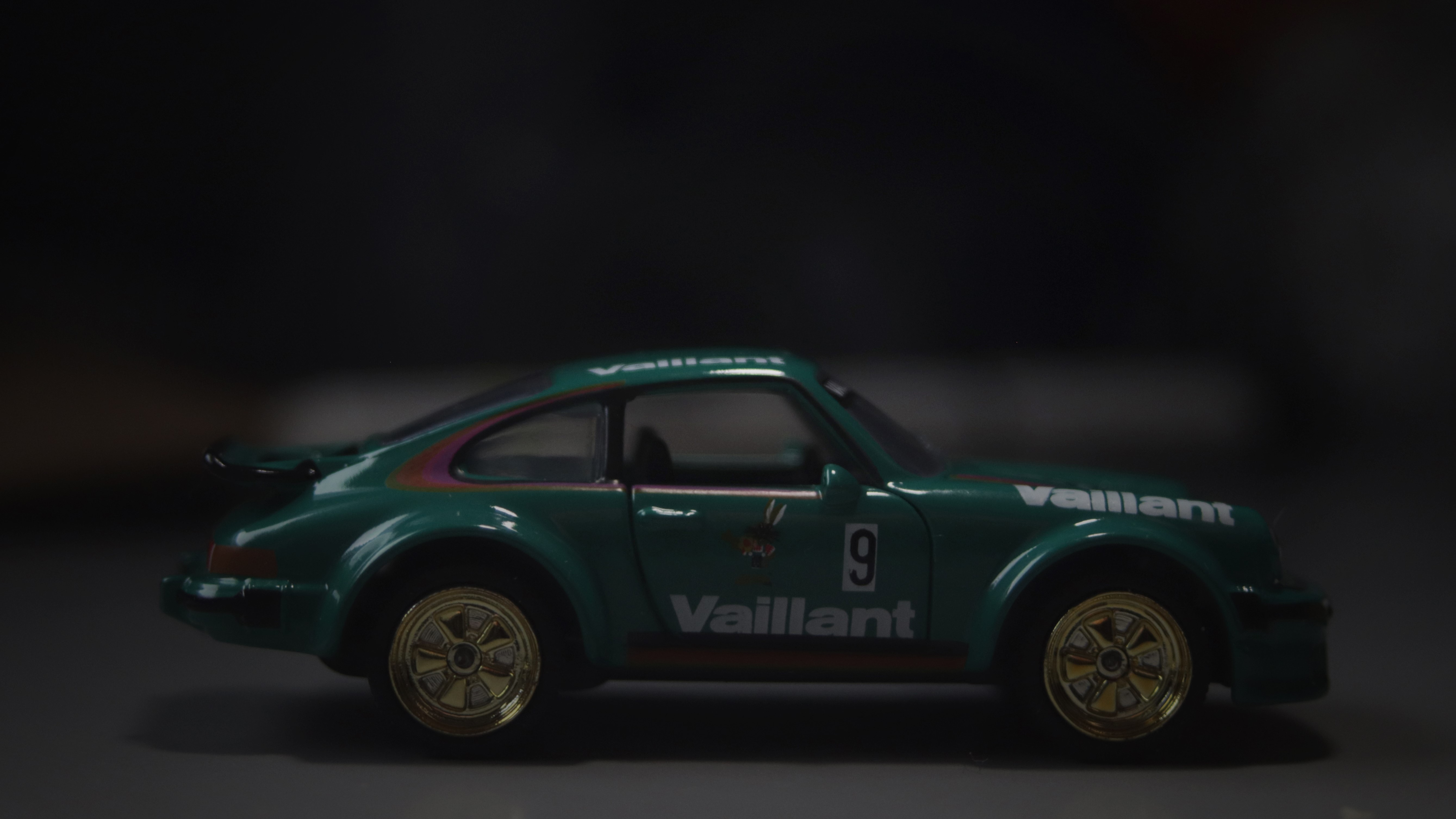 Green Porsche 911 toy car with Vaillant livery HD Wallpaper
