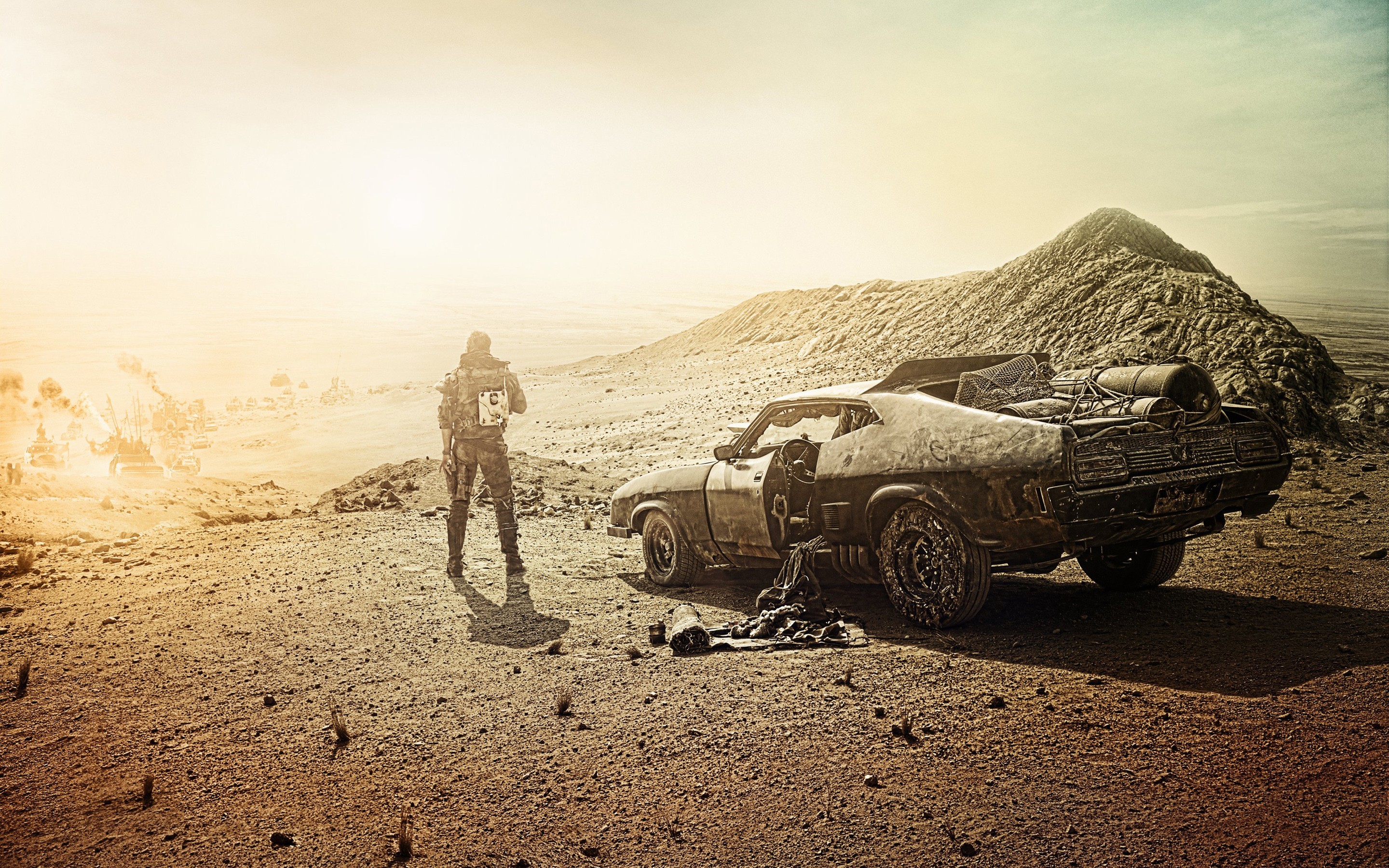 Max from Mad Max: Fury Road with his car in the desert HD Wallpaper