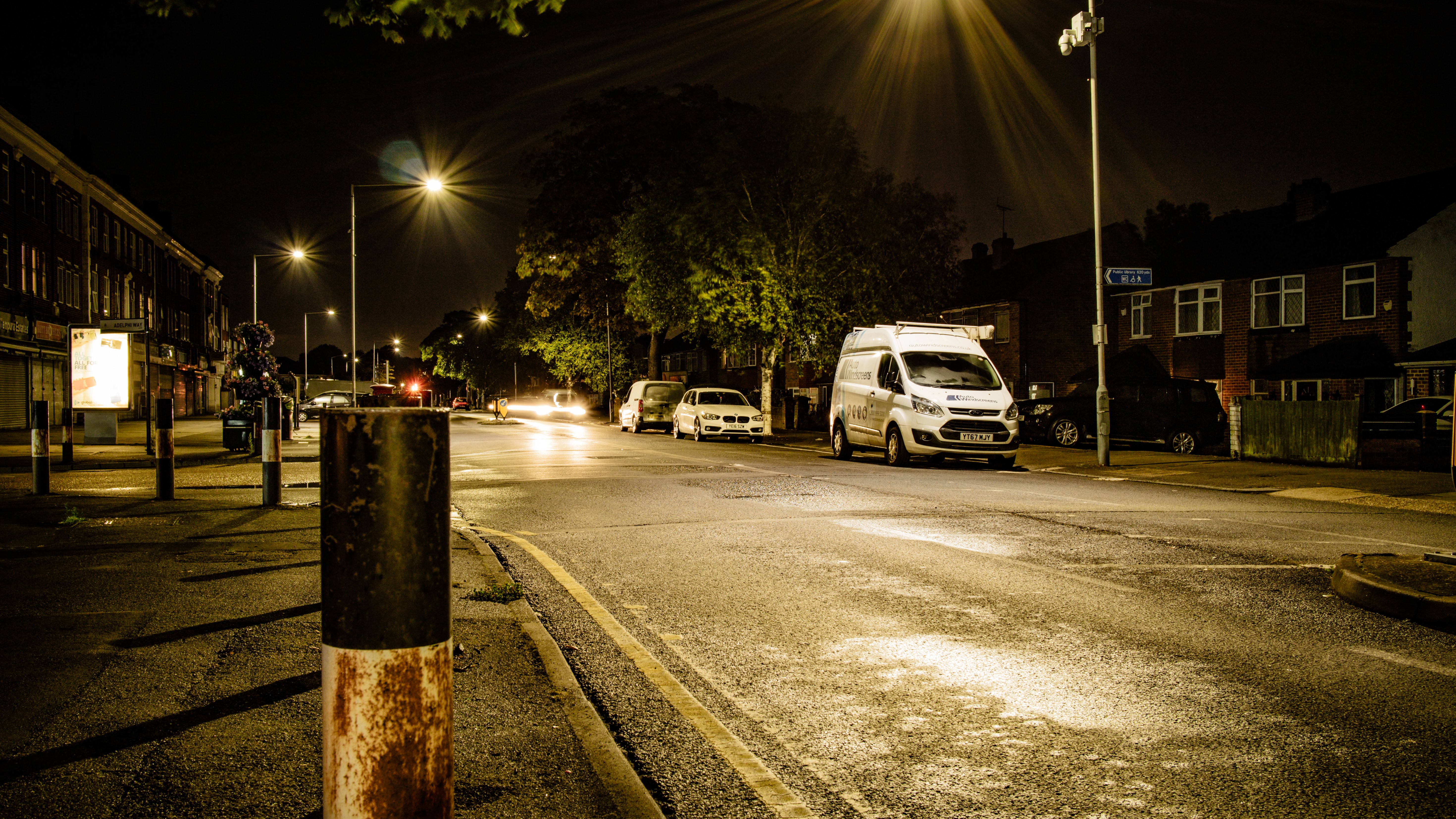 Street at night with cars and buildings HD Wallpaper