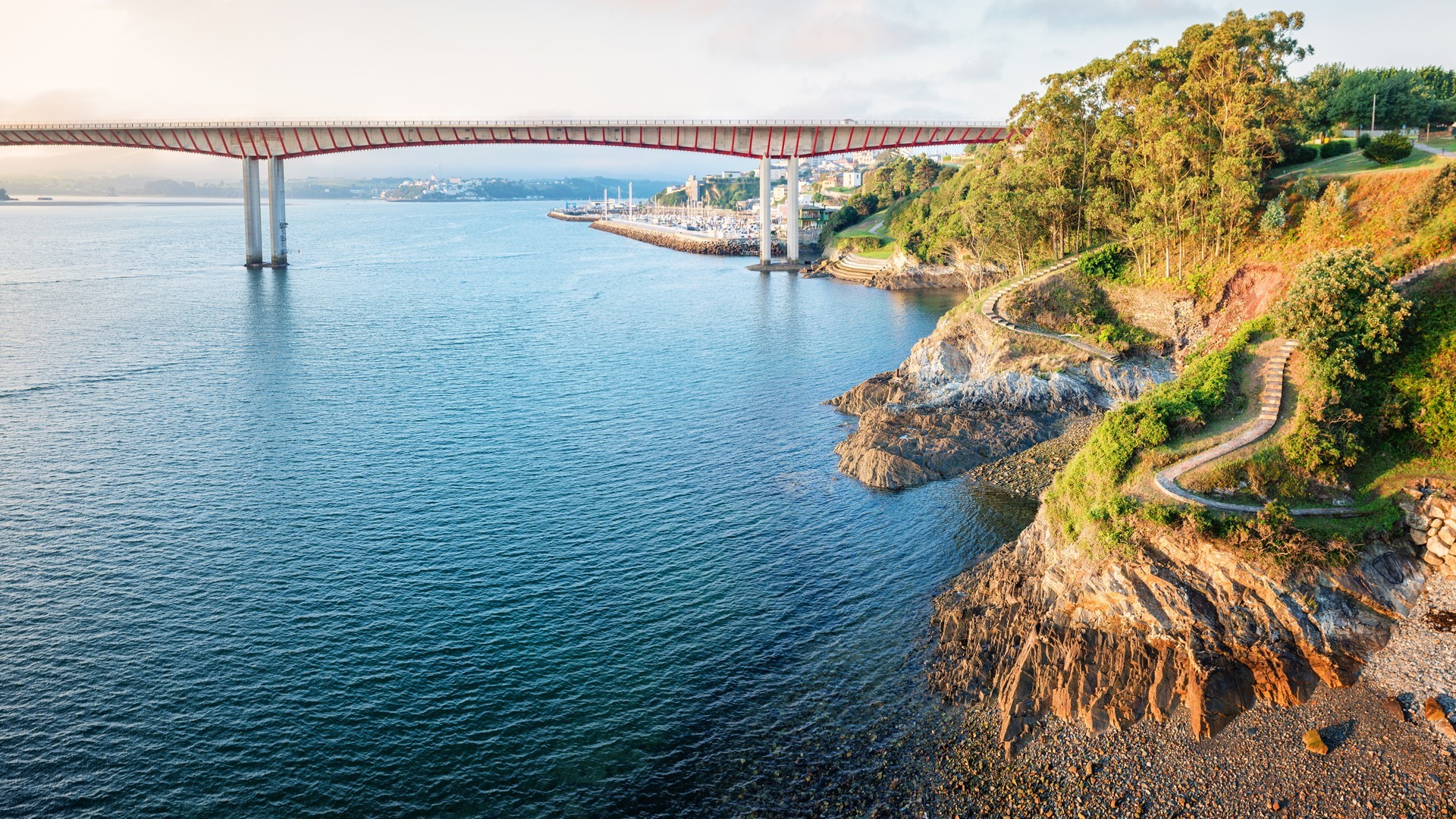 Bridge over a bay with a coastal path HD Wallpaper