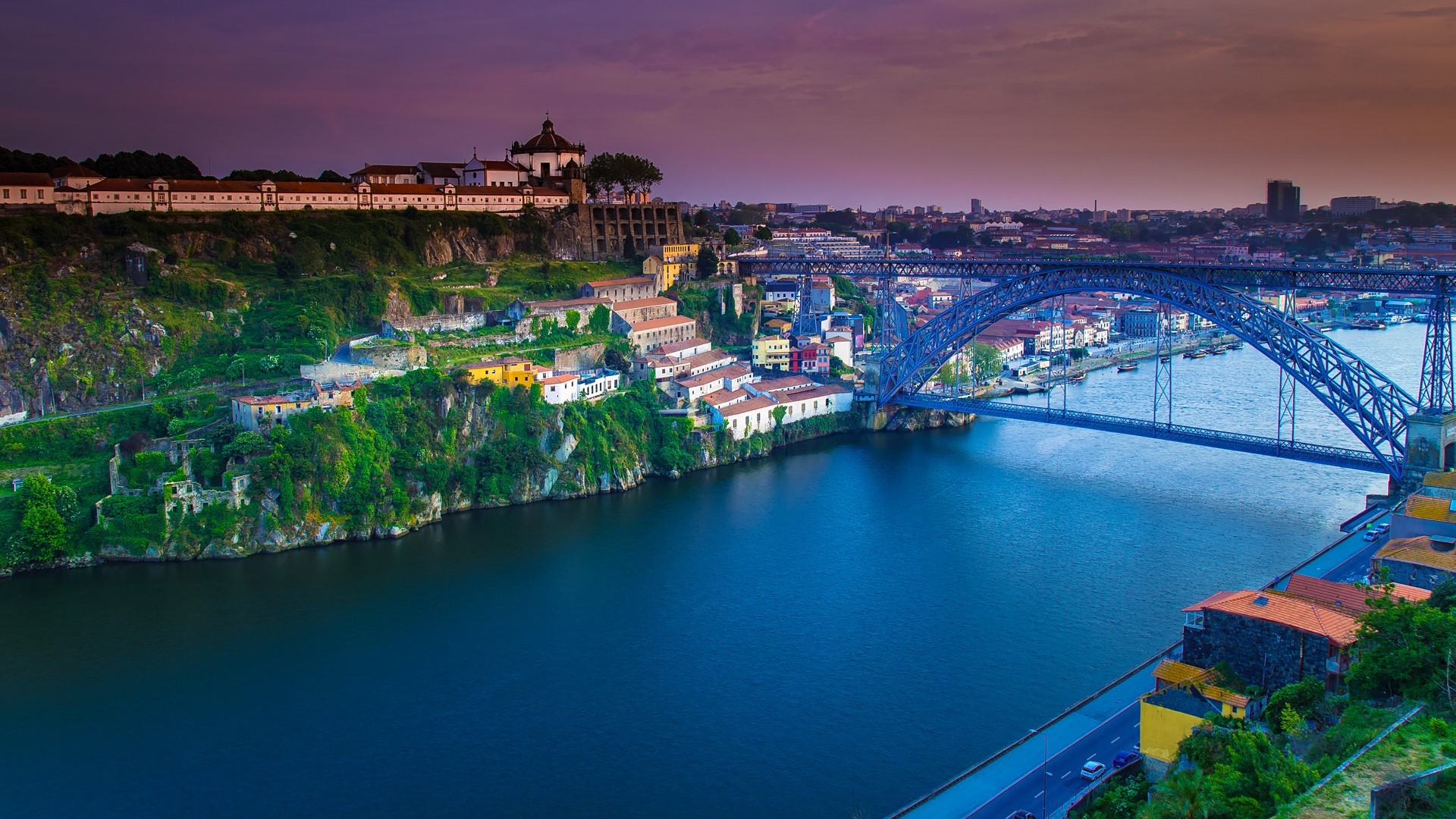 Dom Luís I Bridge over the Douro River at sunset in Porto, Portugal HD Wallpaper
