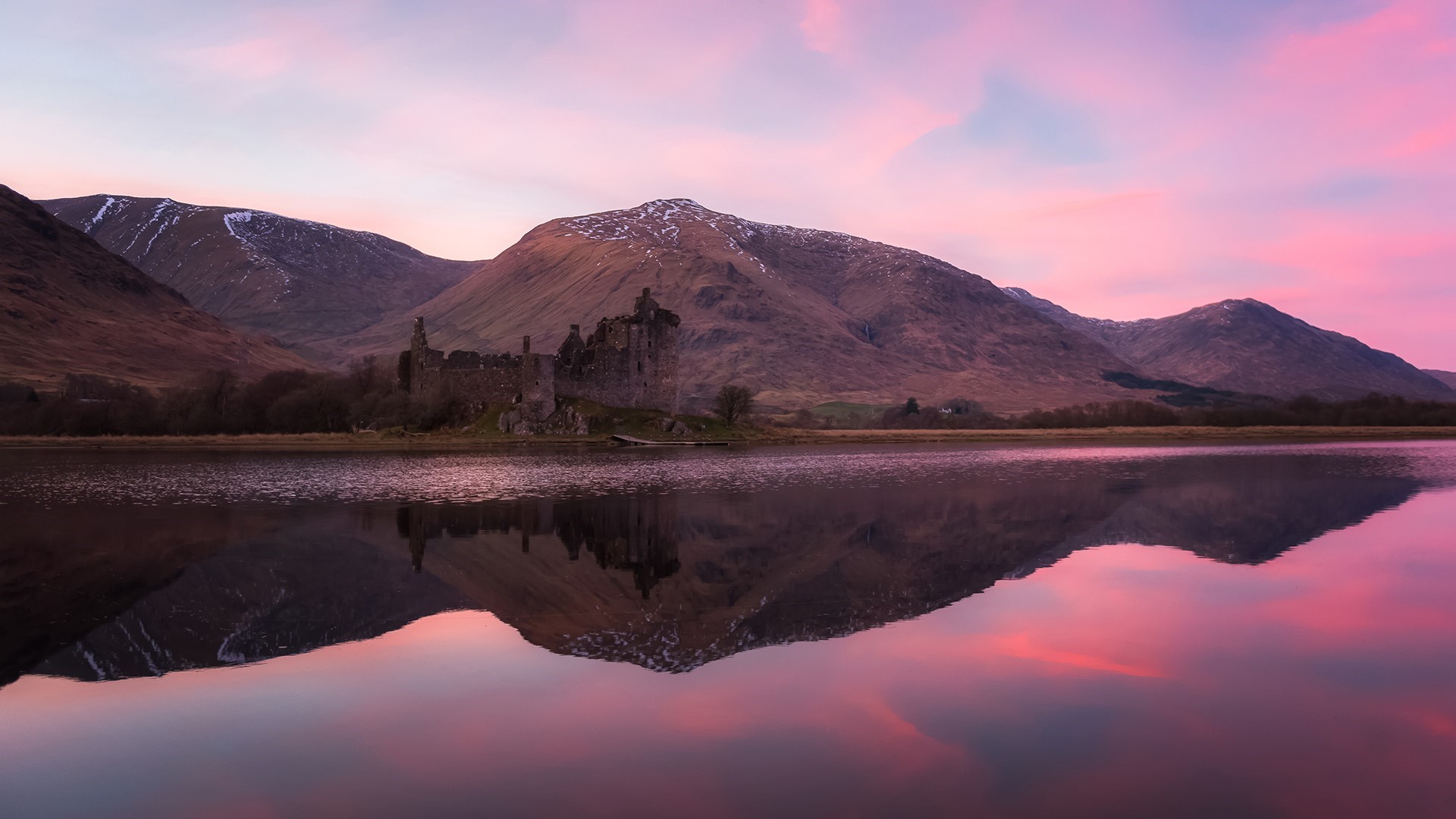Kilchurn Castle ruins reflected in a lake at sunset, Scotland HD Wallpaper