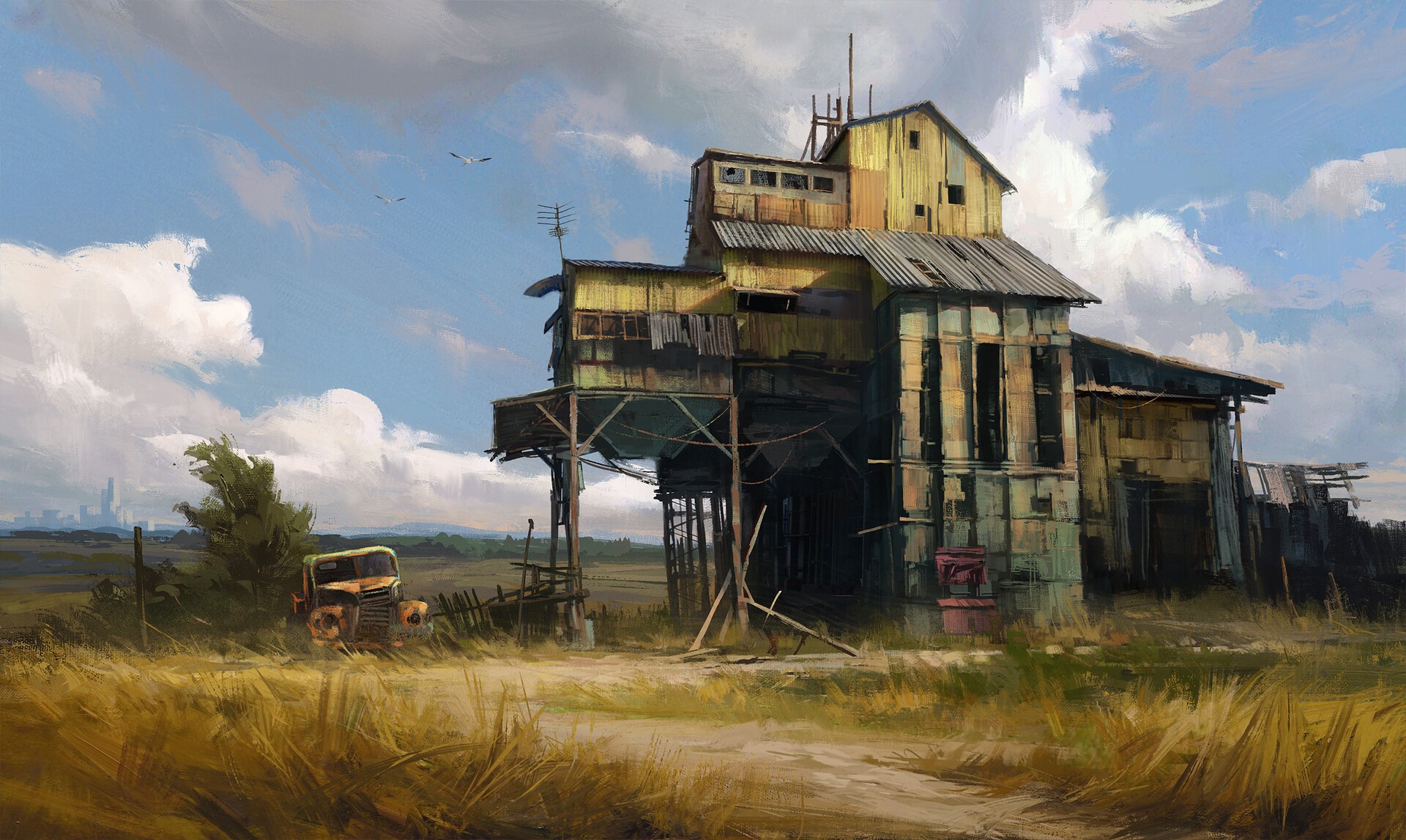 Abandoned industrial building and wrecked truck in a field HD Wallpaper