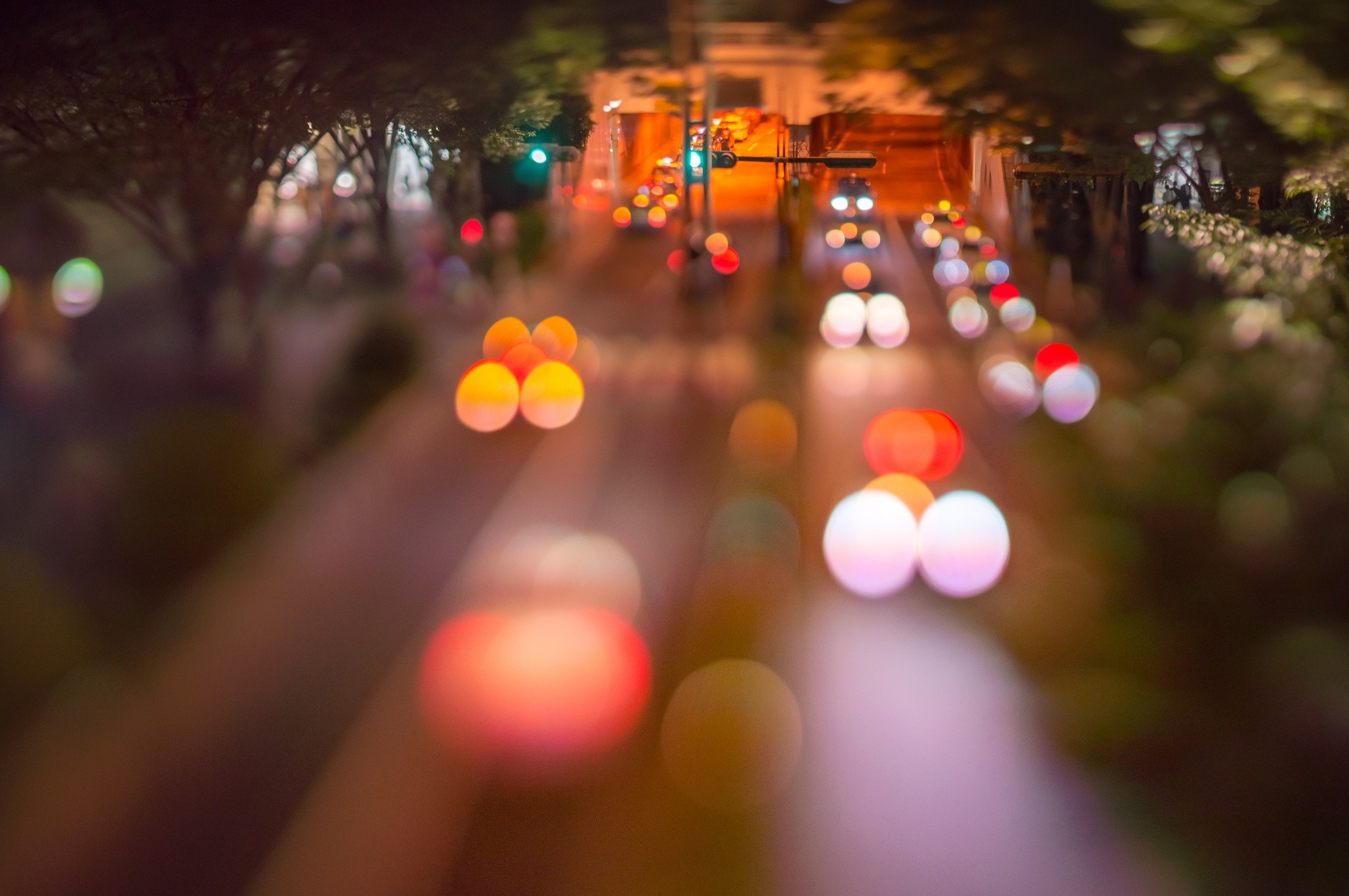 Bokeh effect of city traffic lights at night HD Wallpaper