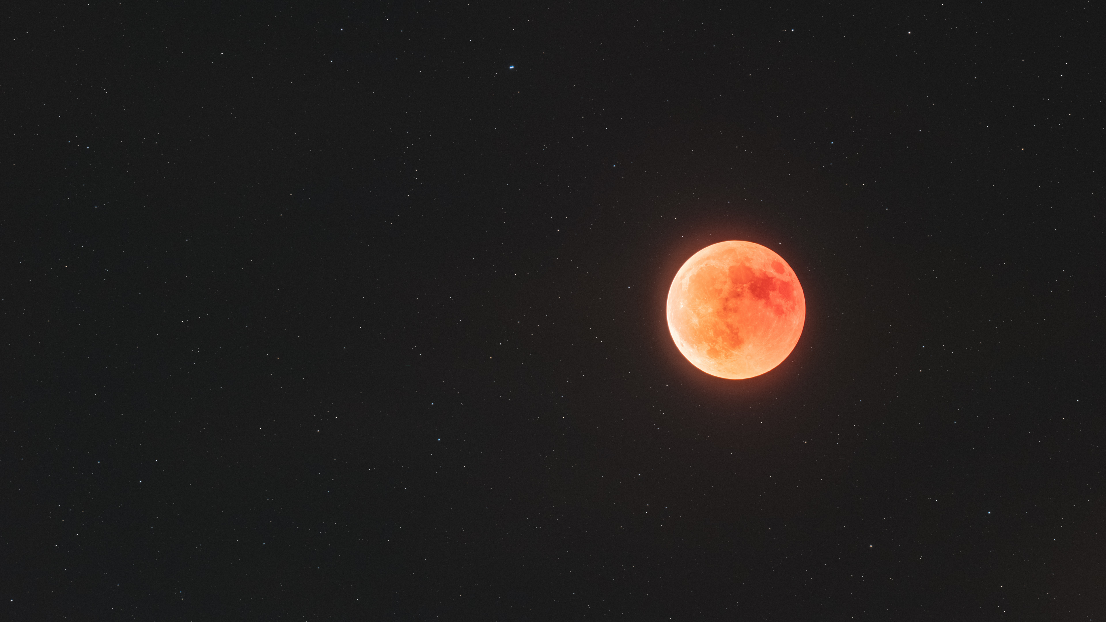 Red Moon in a Starry Night Sky 4K HD Wallpaper