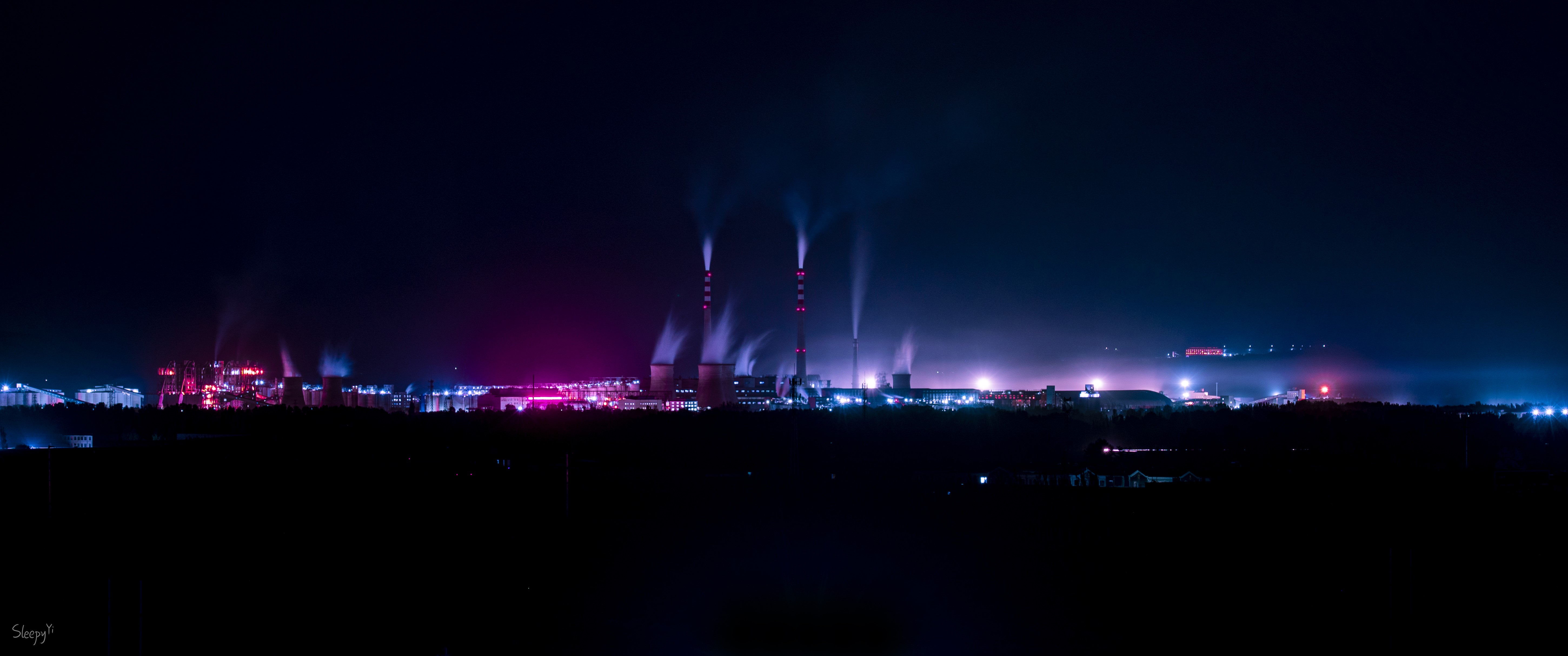 Factory at night with pink and blue lights HD Wallpaper