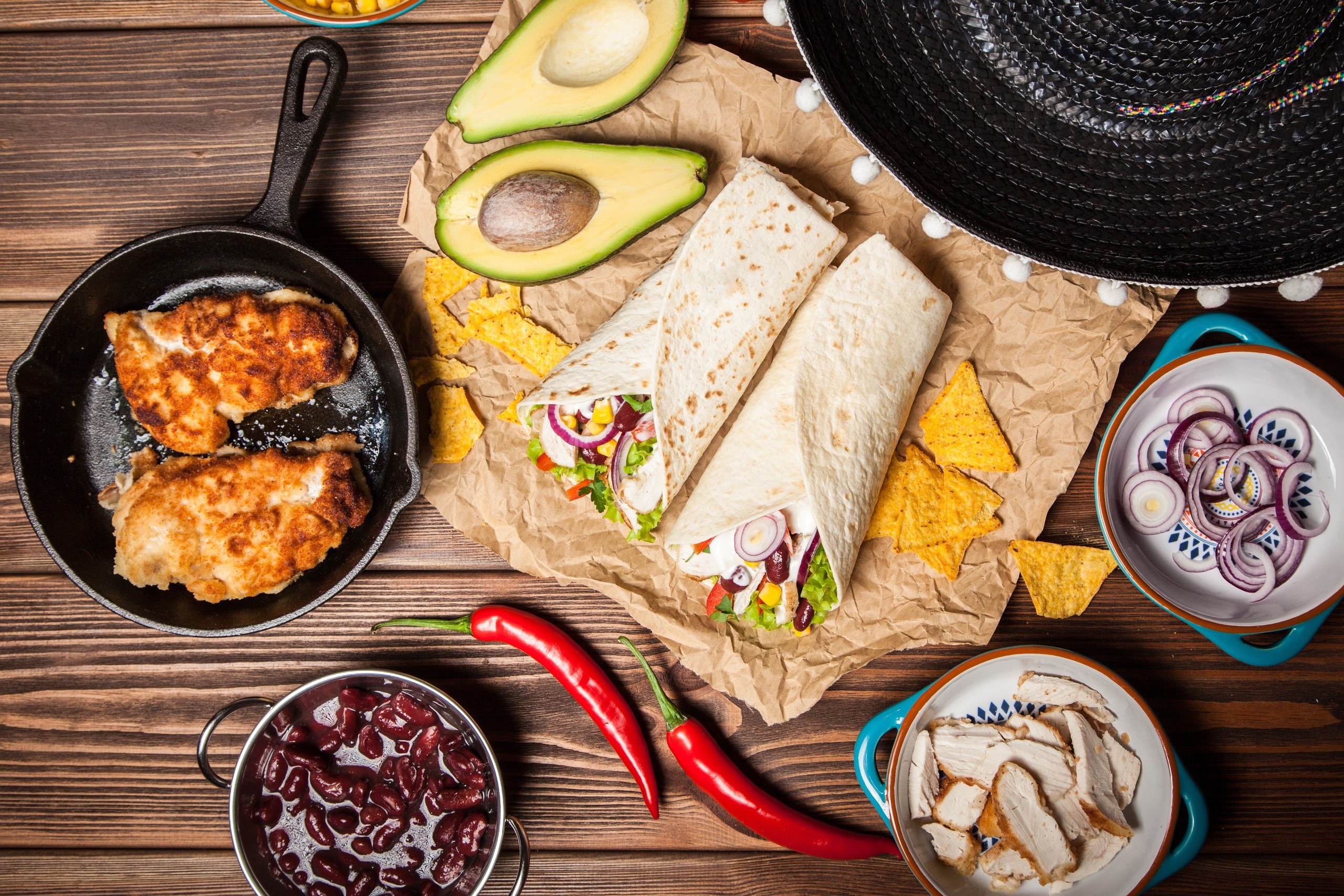 Mexican food spread with tortillas, chicken, and avocado HD Wallpaper