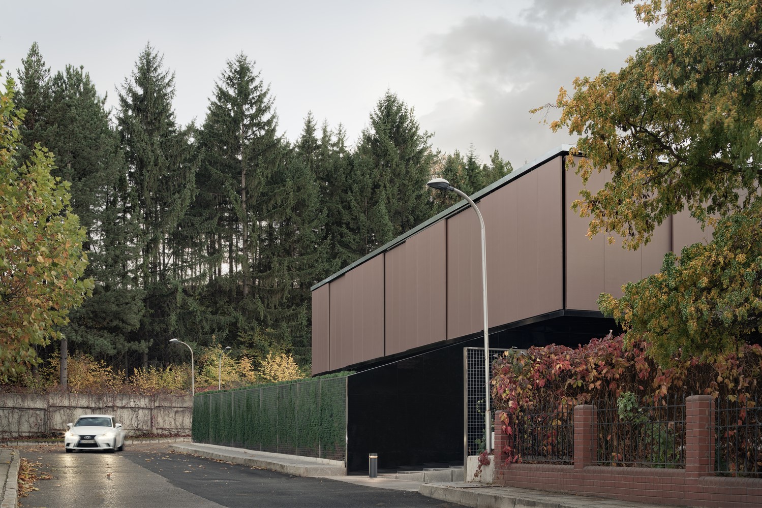 Modern house with trees and street HD Wallpaper