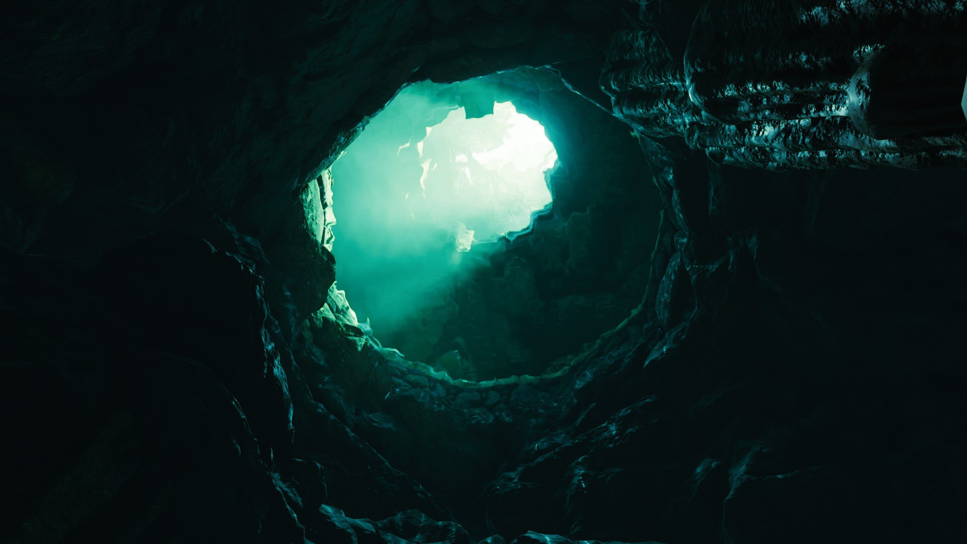 Cave opening with light beams HD Wallpaper