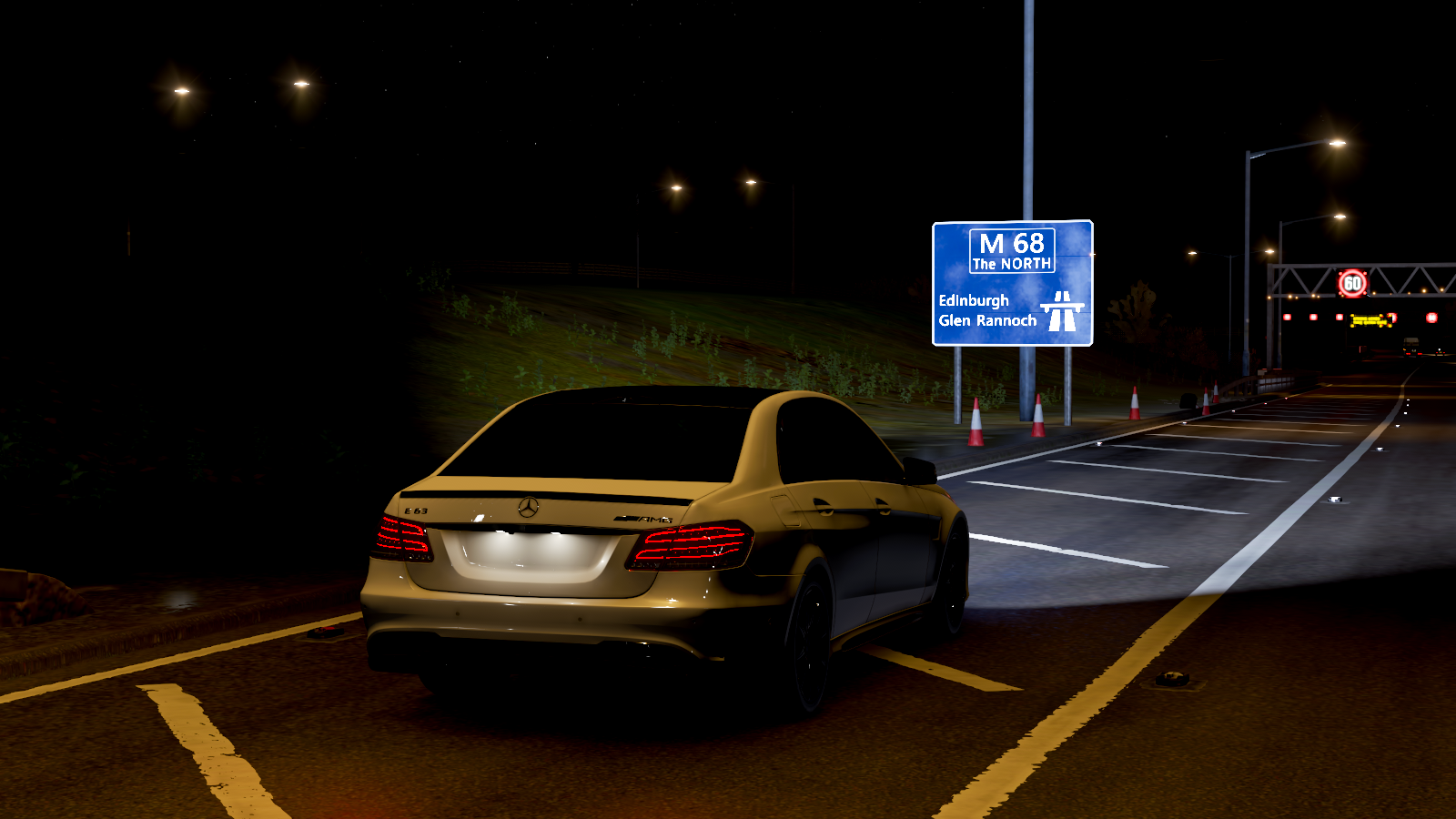Mercedes AMG E63 on M68 highway at night HD Wallpaper