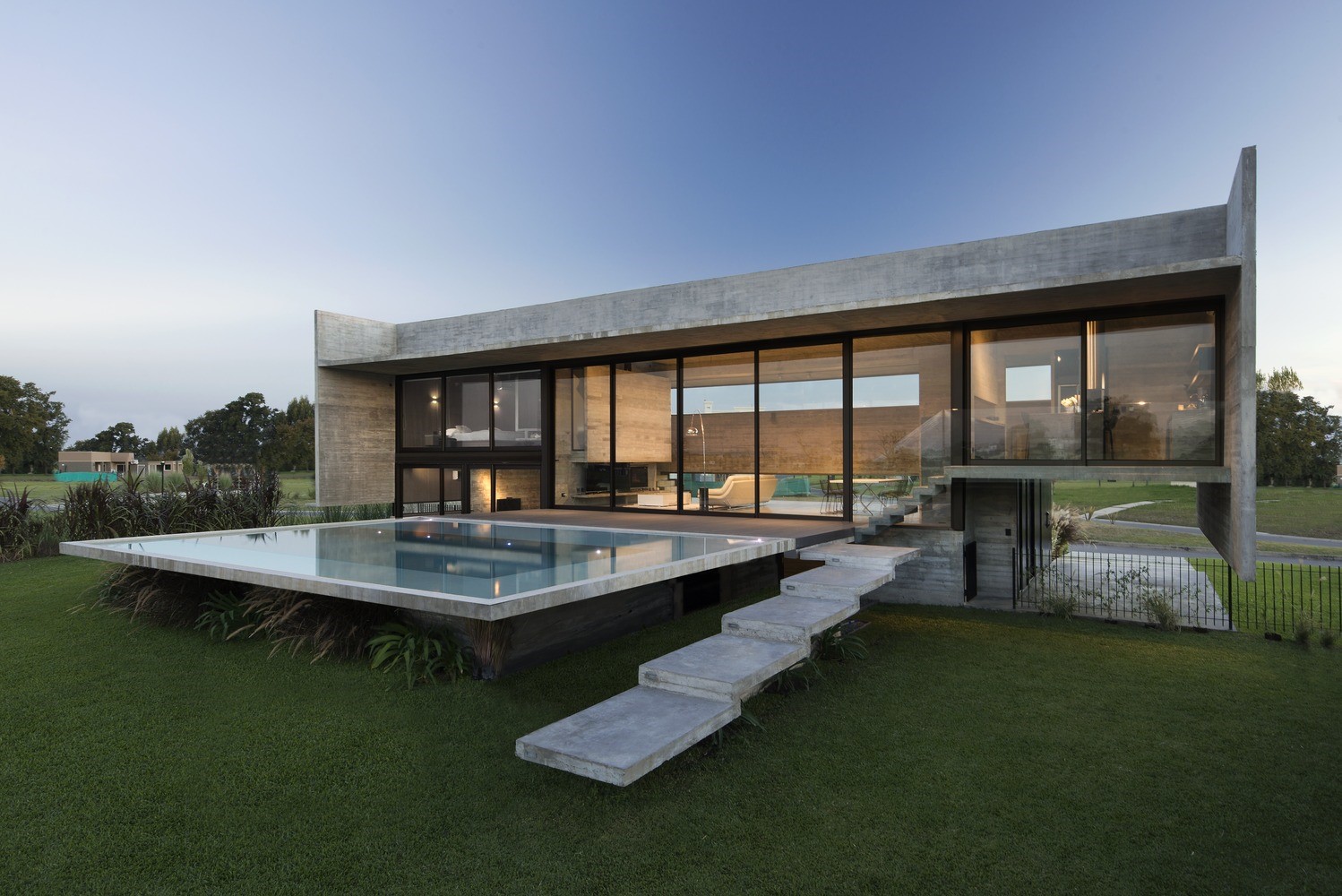Modern concrete house with swimming pool HD Wallpaper