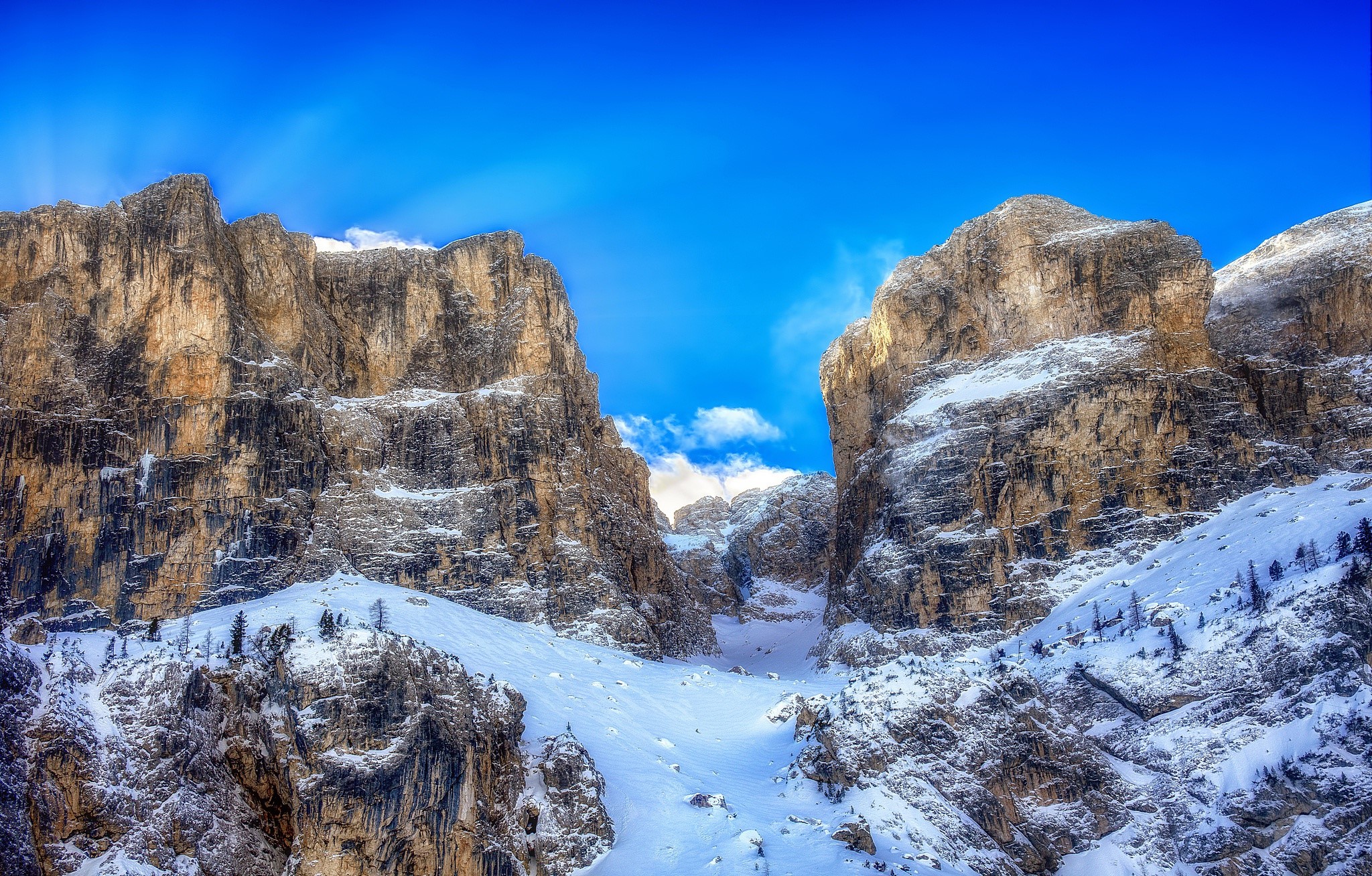 Snowy mountains in the Dolomites under a blue sky HD Wallpaper