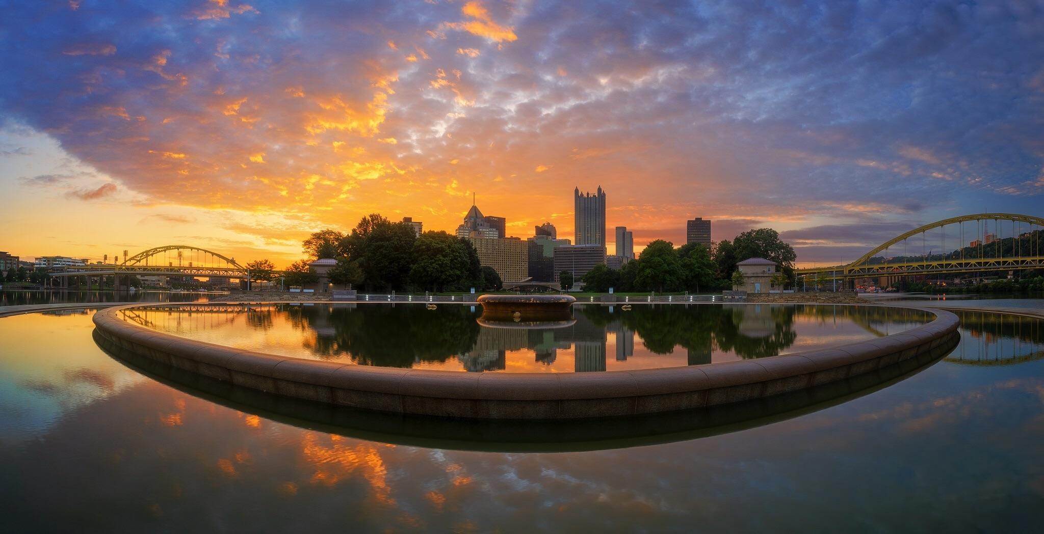 Pittsburgh skyline and bridges at sunset with fountain reflection HD Wallpaper