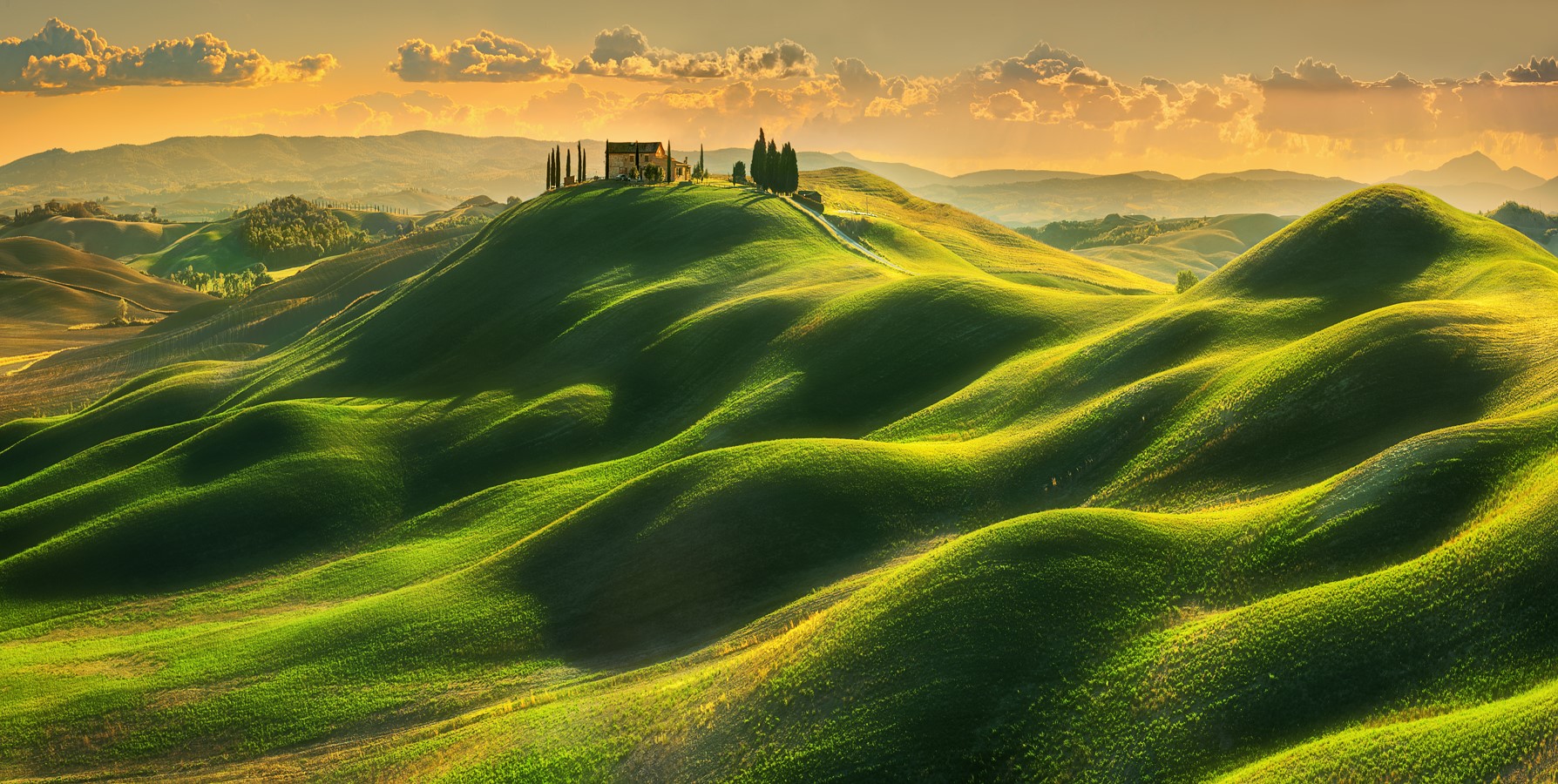 Tuscan landscape with rolling hills and a house at sunset HD Wallpaper
