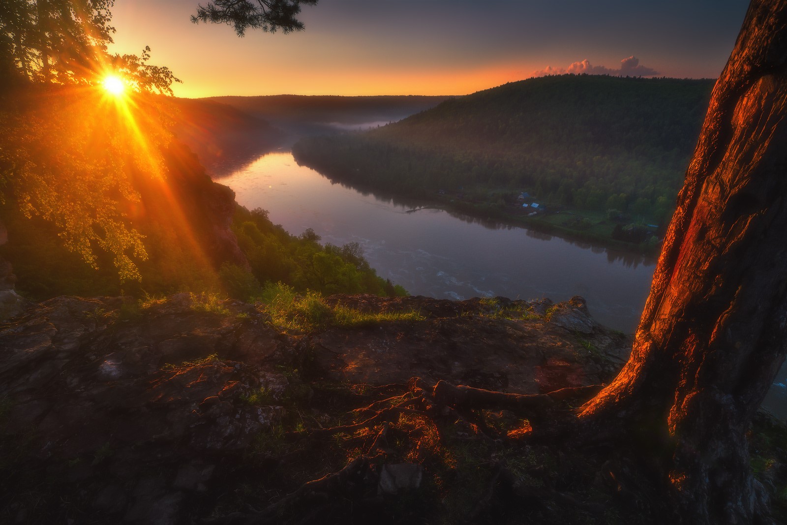Sunset over a river valley with trees and hills HD Wallpaper