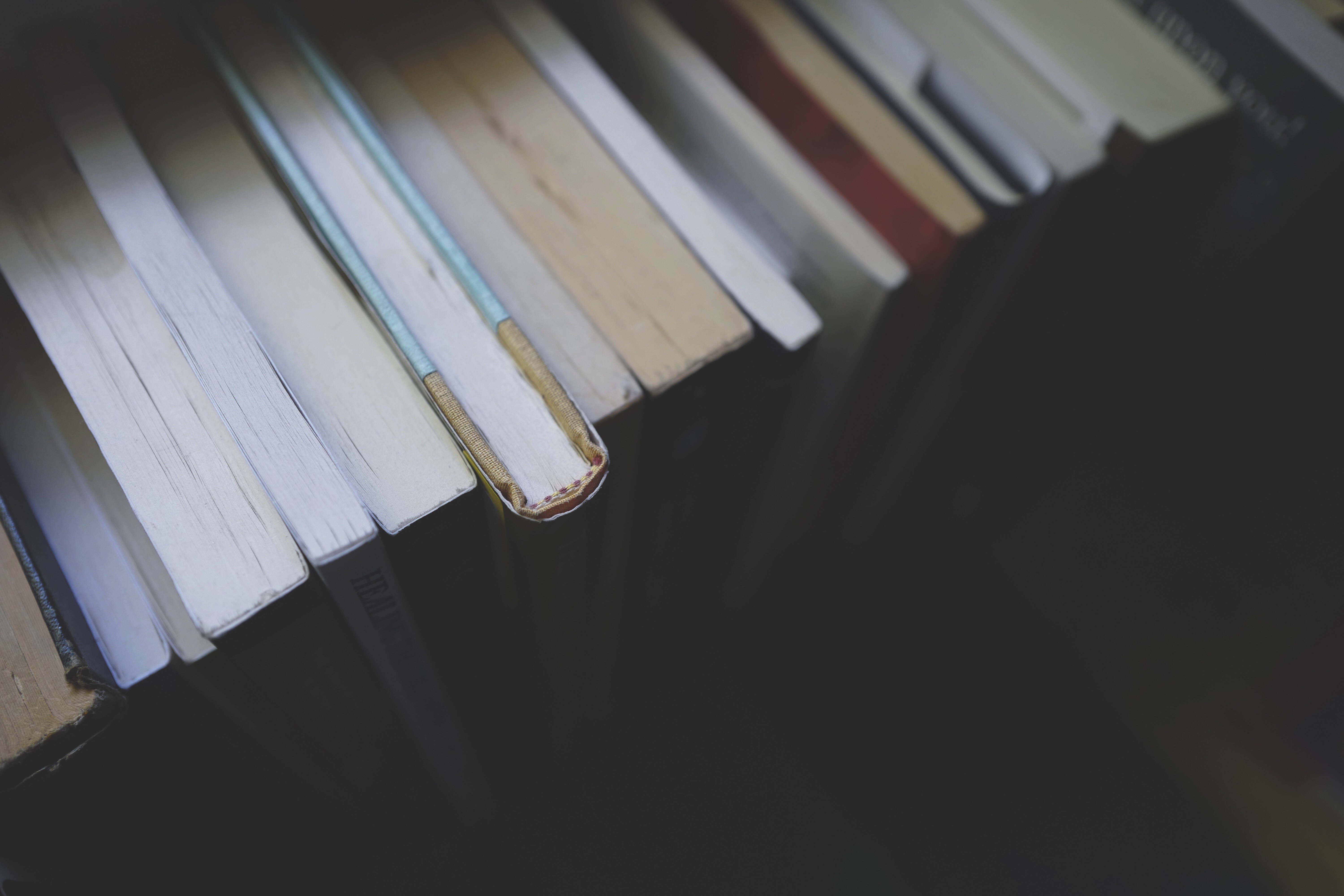 Close-up of old books on a shelf HD Wallpaper