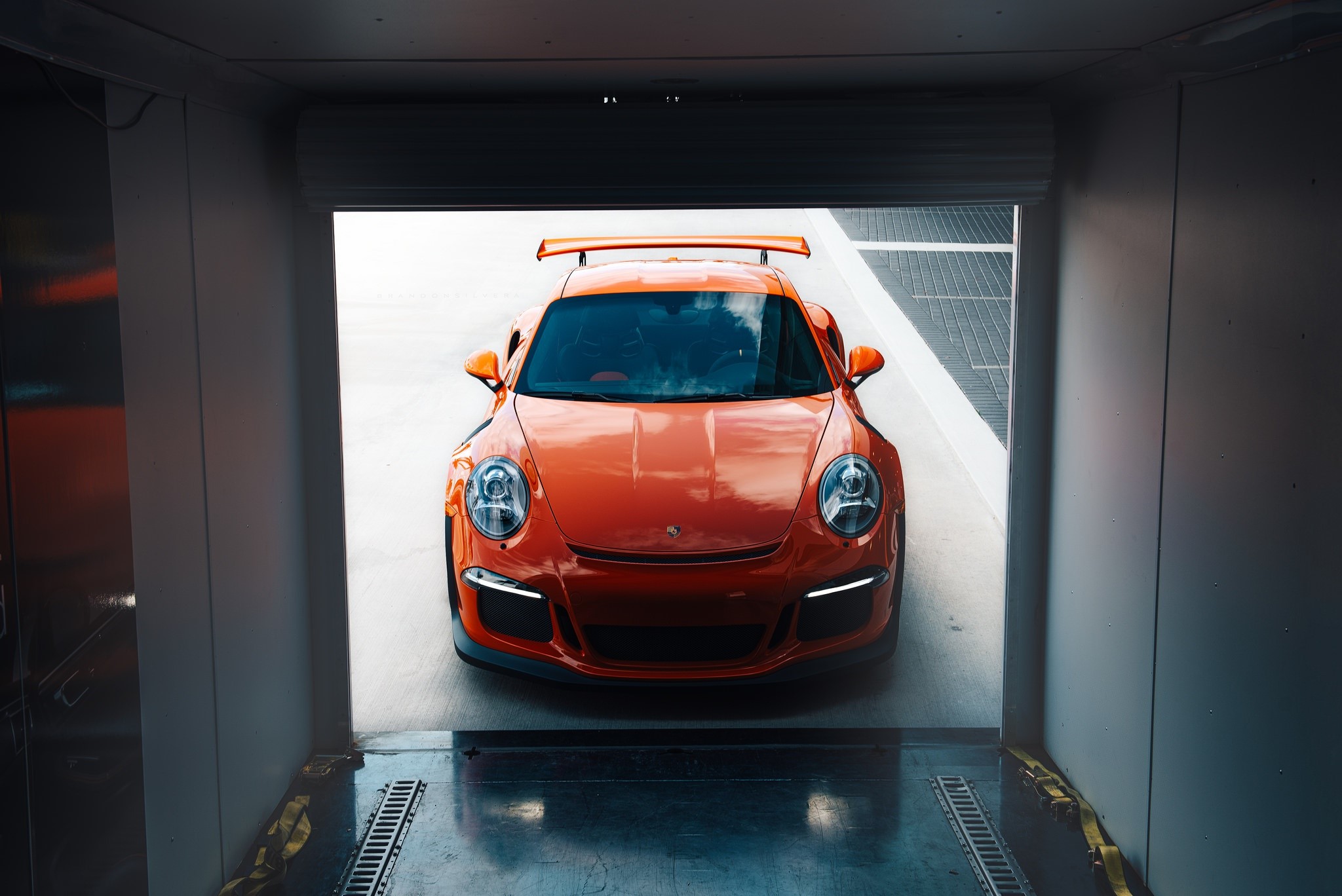 Orange Porsche 911 GT3 RS exiting a trailer HD Wallpaper