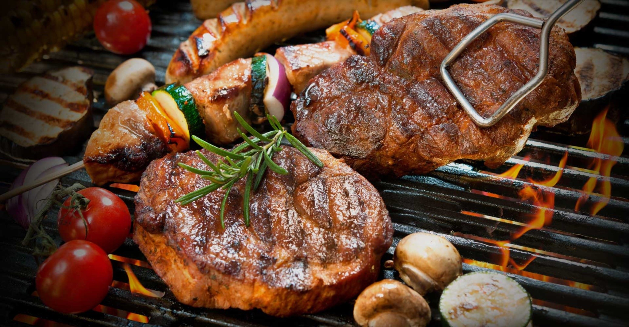 Steak and vegetables grilling on a barbecue HD Wallpaper