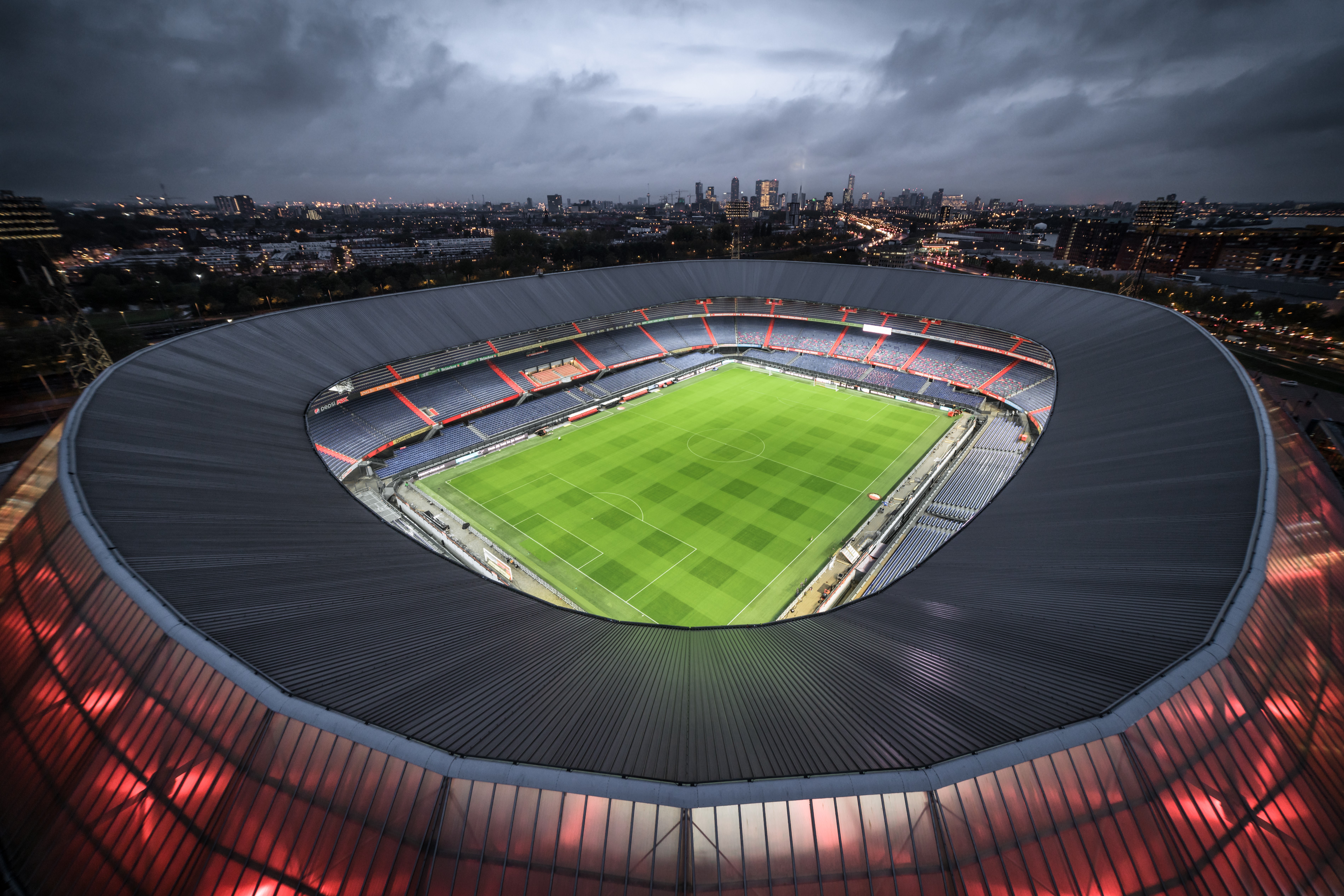 4K Soccer Stadium and Cityscape at Dusk HD Wallpaper