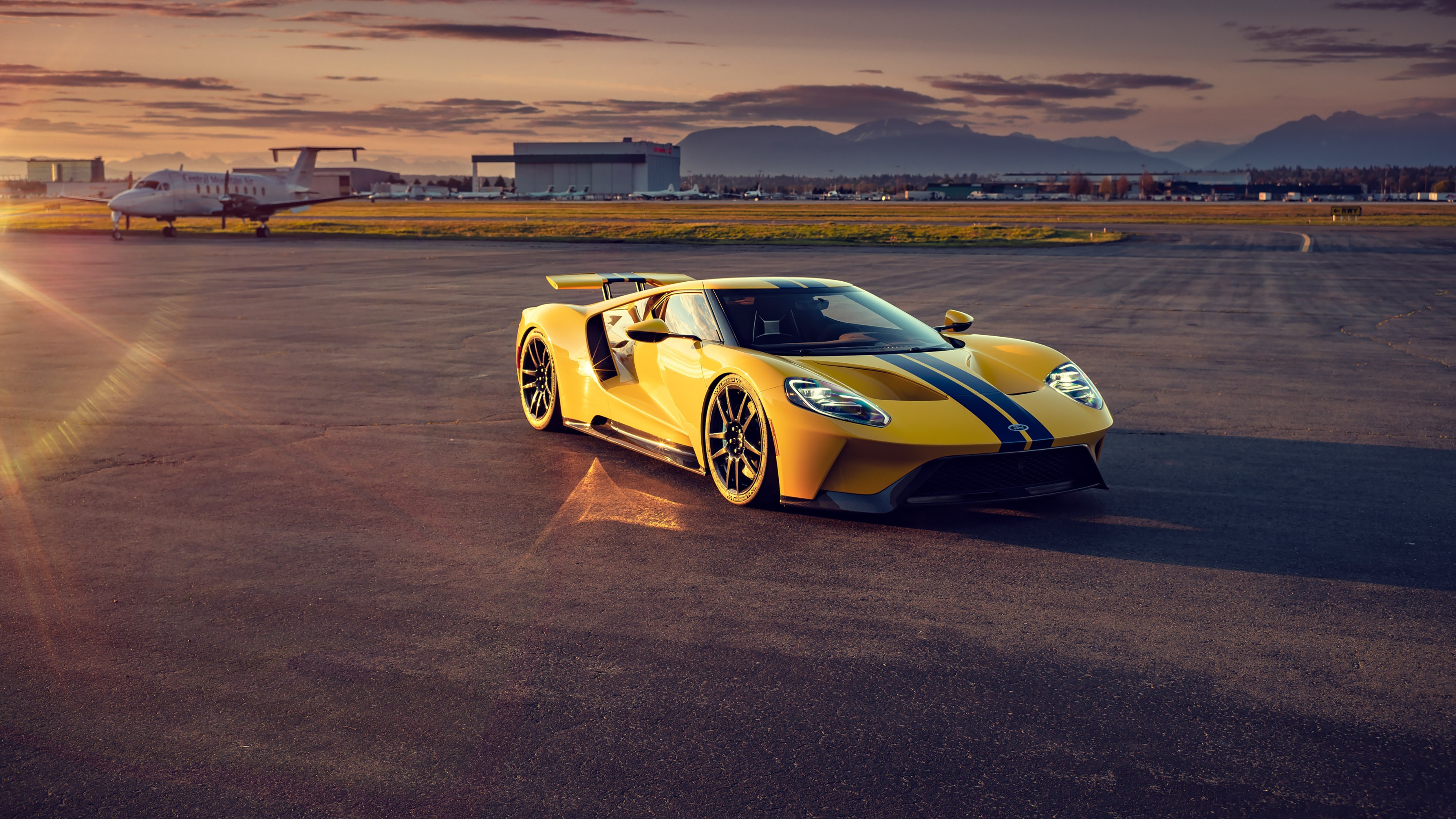 Yellow Ford GT Mk II on Airport Tarmac at Sunset HD Wallpaper