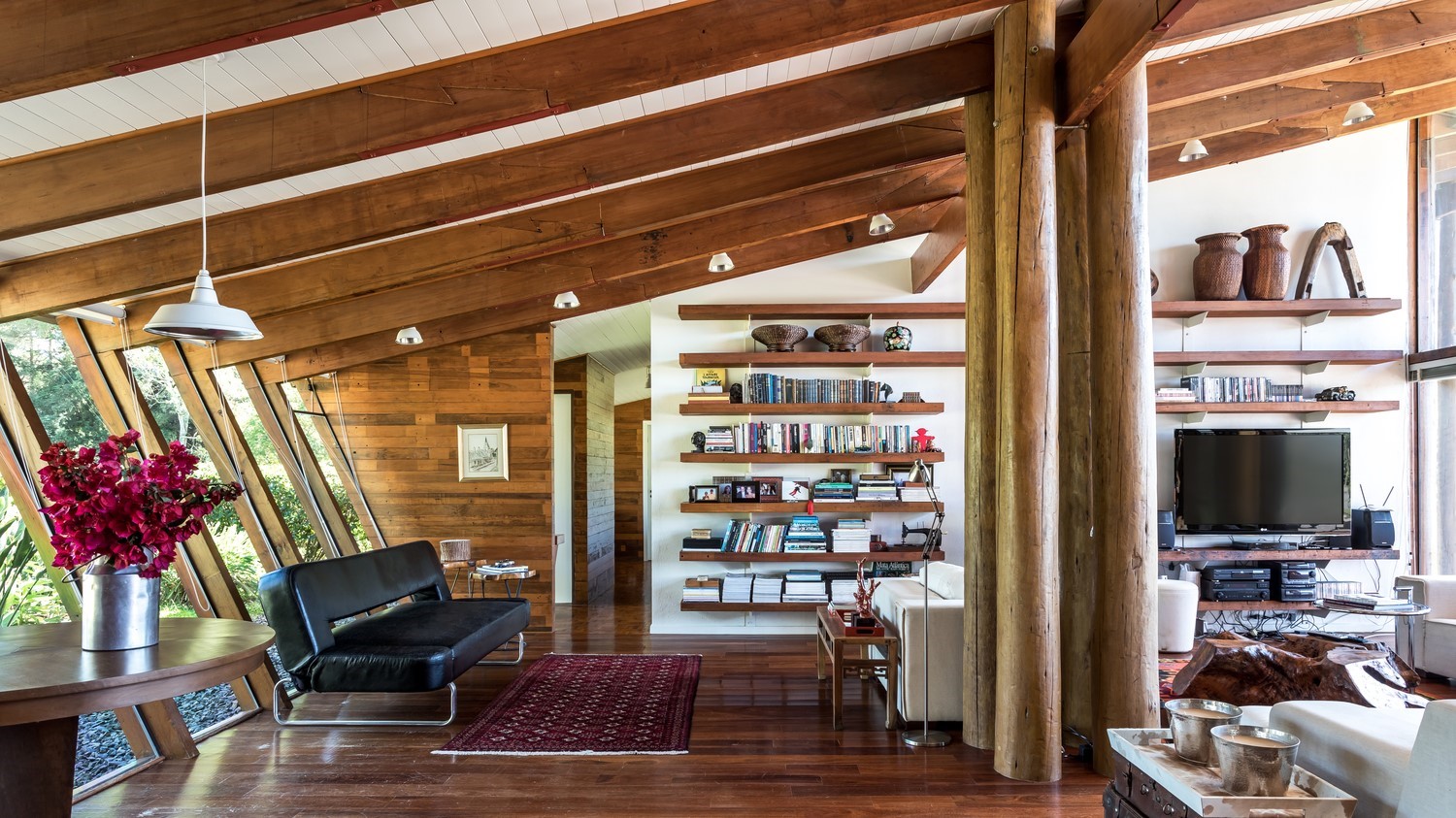Modern wooden house interior with living room and bookshelves HD Wallpaper