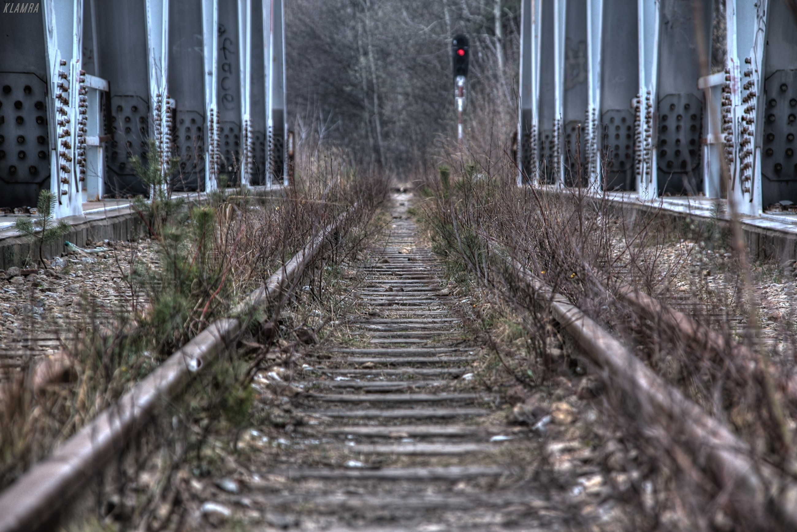 Abandoned railway tracks under a bridge in Katowice, Poland HD Wallpaper