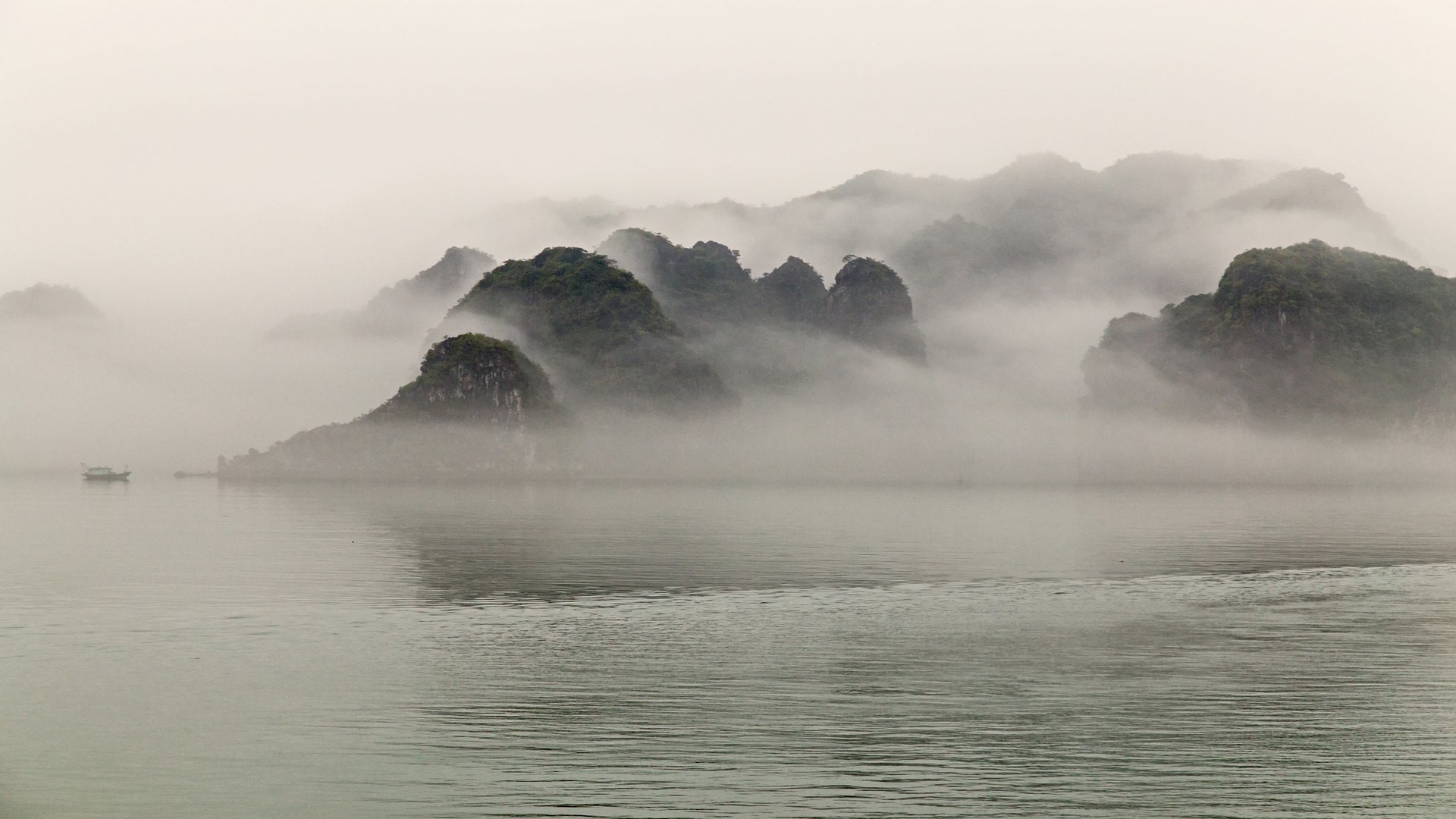 Misty Halong Bay landscape with islands and boat HD Wallpaper