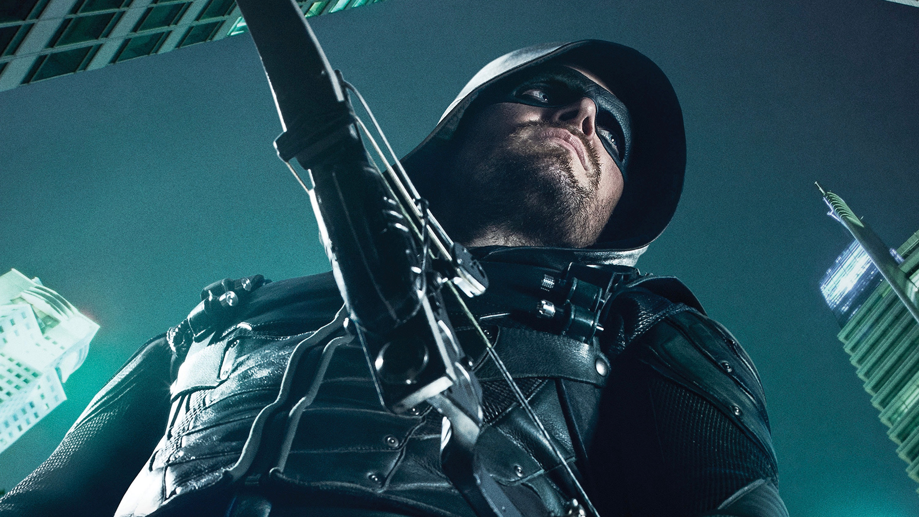 Stephen Amell as Arrow with a bow and arrow HD Wallpaper
