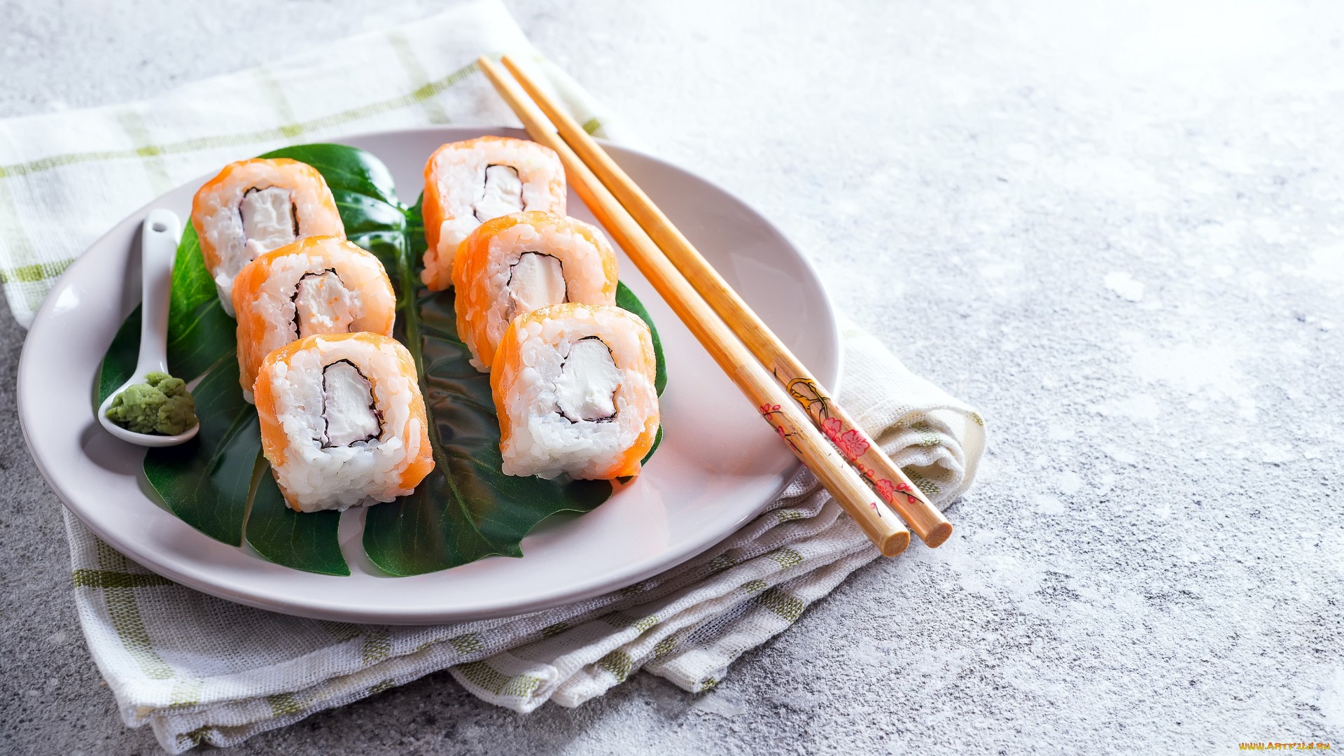 Sushi rolls with wasabi on a plate with chopsticks HD Wallpaper