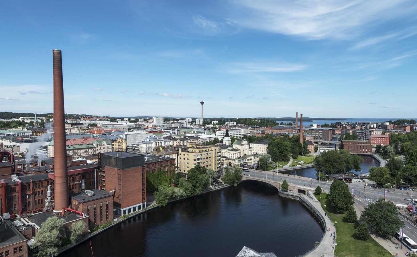 Tampere city skyline with river and industrial buildings HD Wallpaper