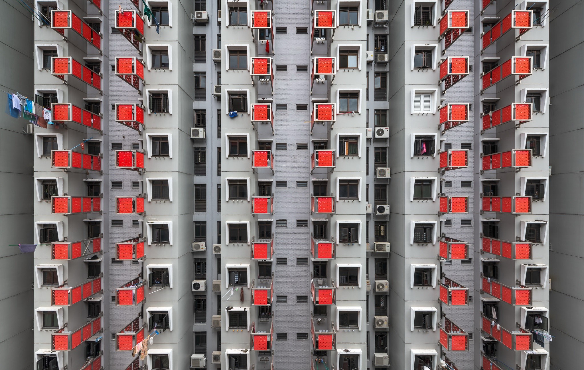 Apartment building with red balconies in Singapore HD Wallpaper