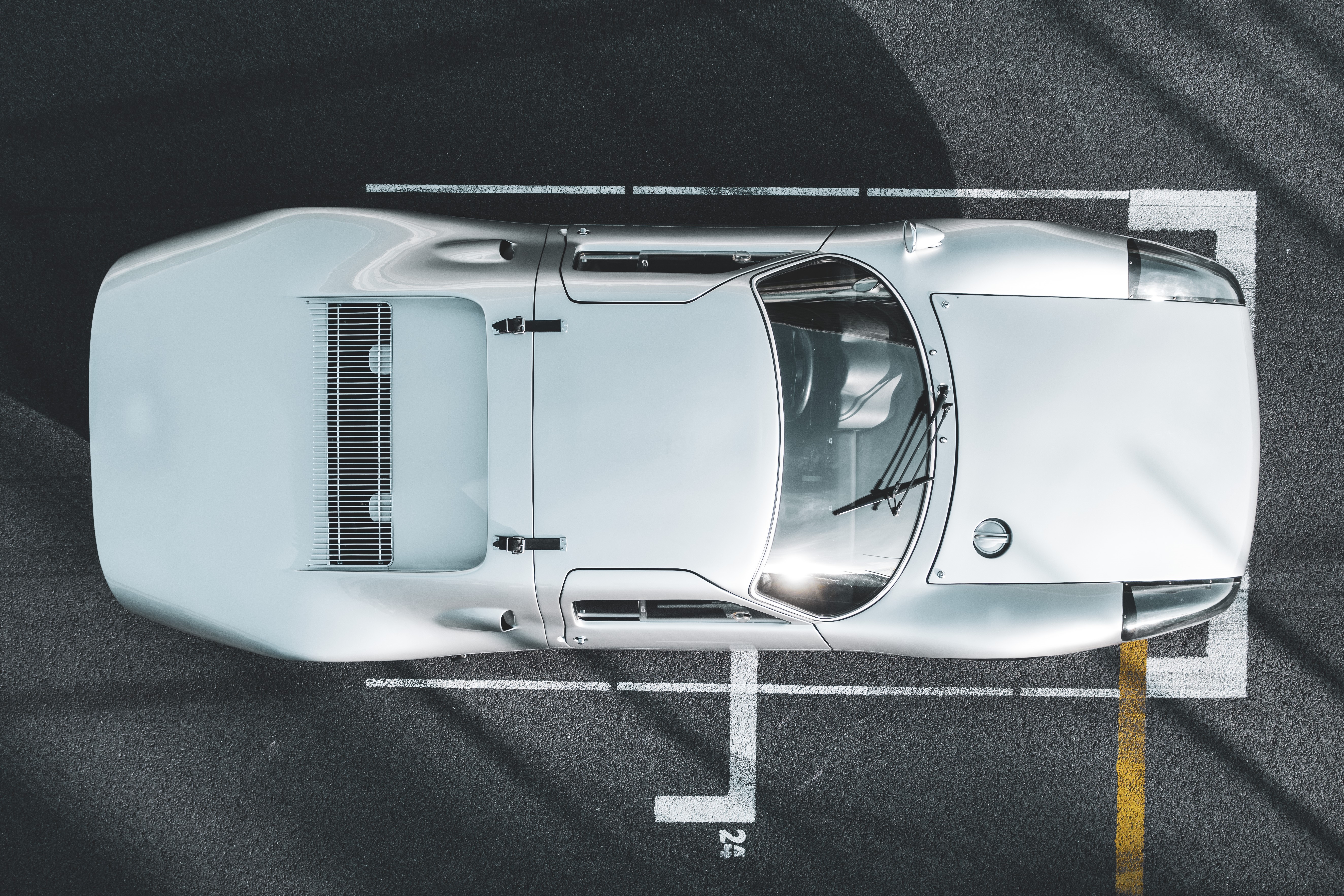 Top view of a silver vintage sports car on a track HD Wallpaper