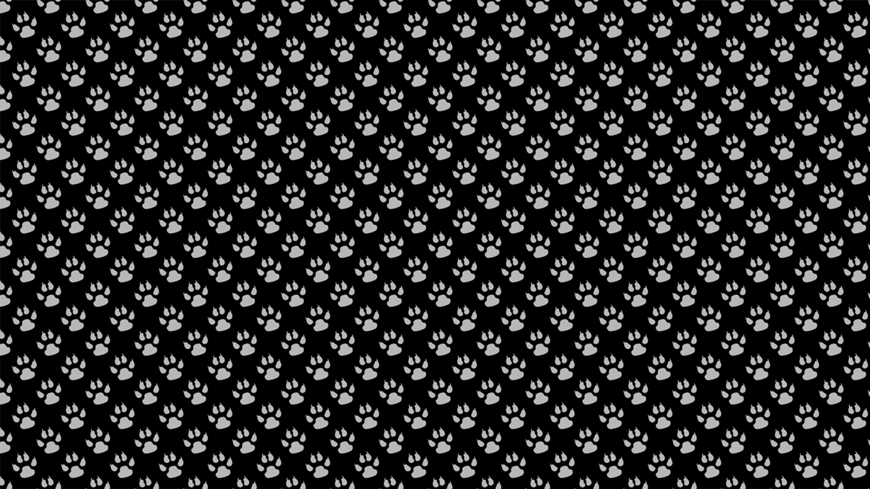 Paw print pattern on black background HD Wallpaper