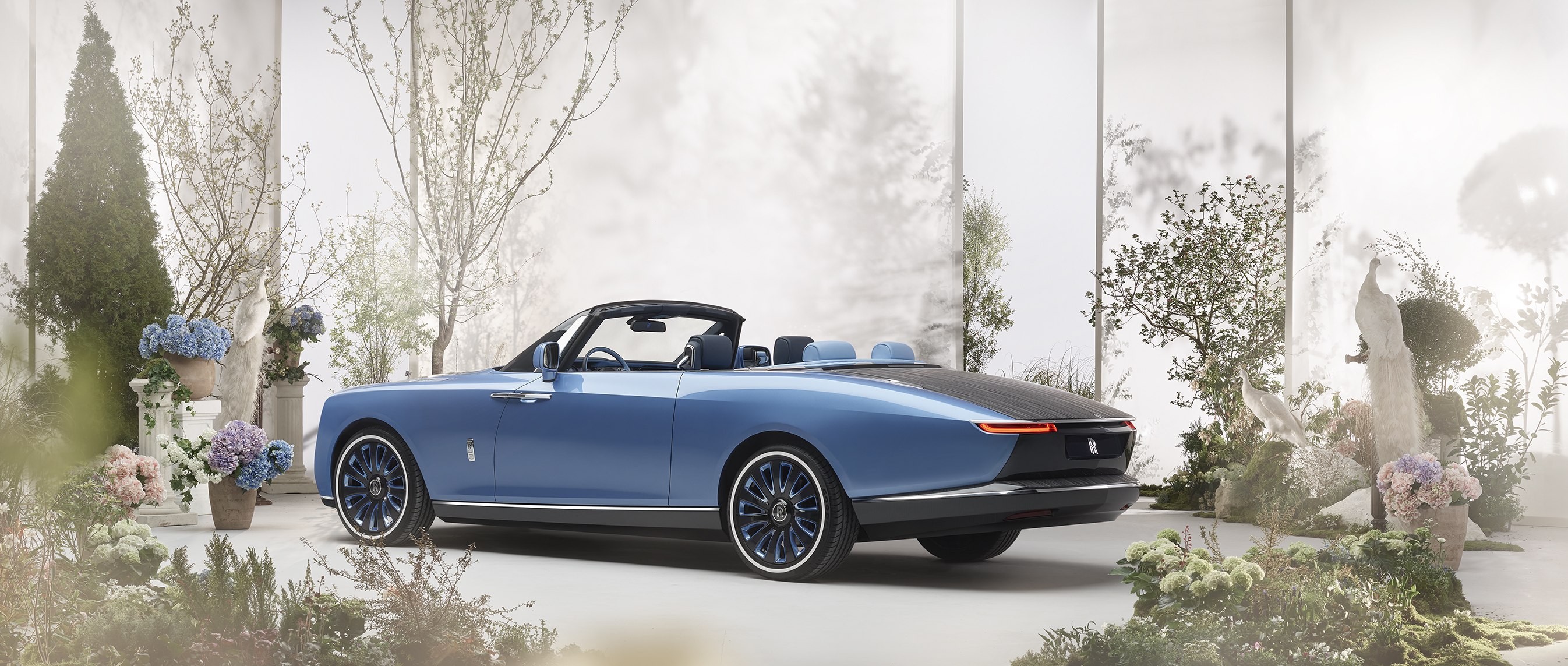 Blue Rolls-Royce Boat Tail convertible in a garden setting HD Wallpaper