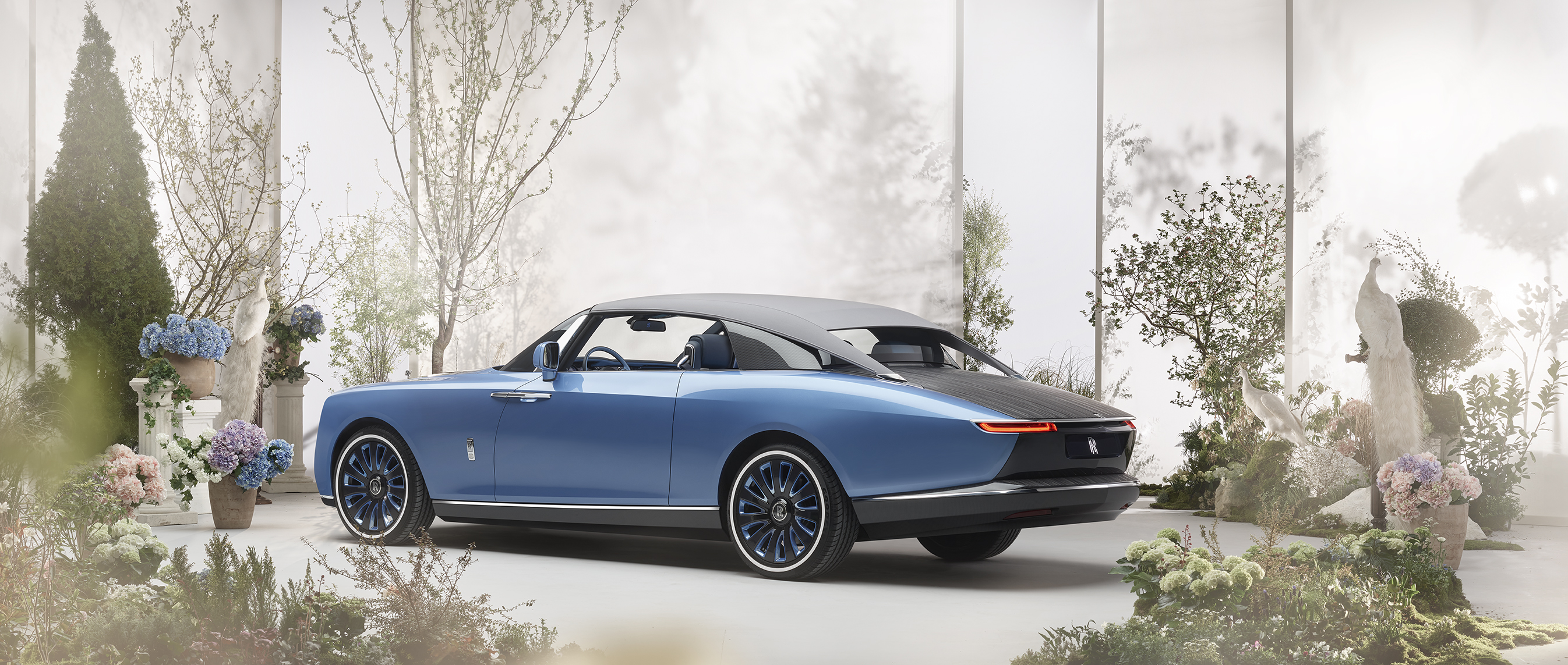 Blue Rolls-Royce Boat Tail luxury car in garden setting HD Wallpaper