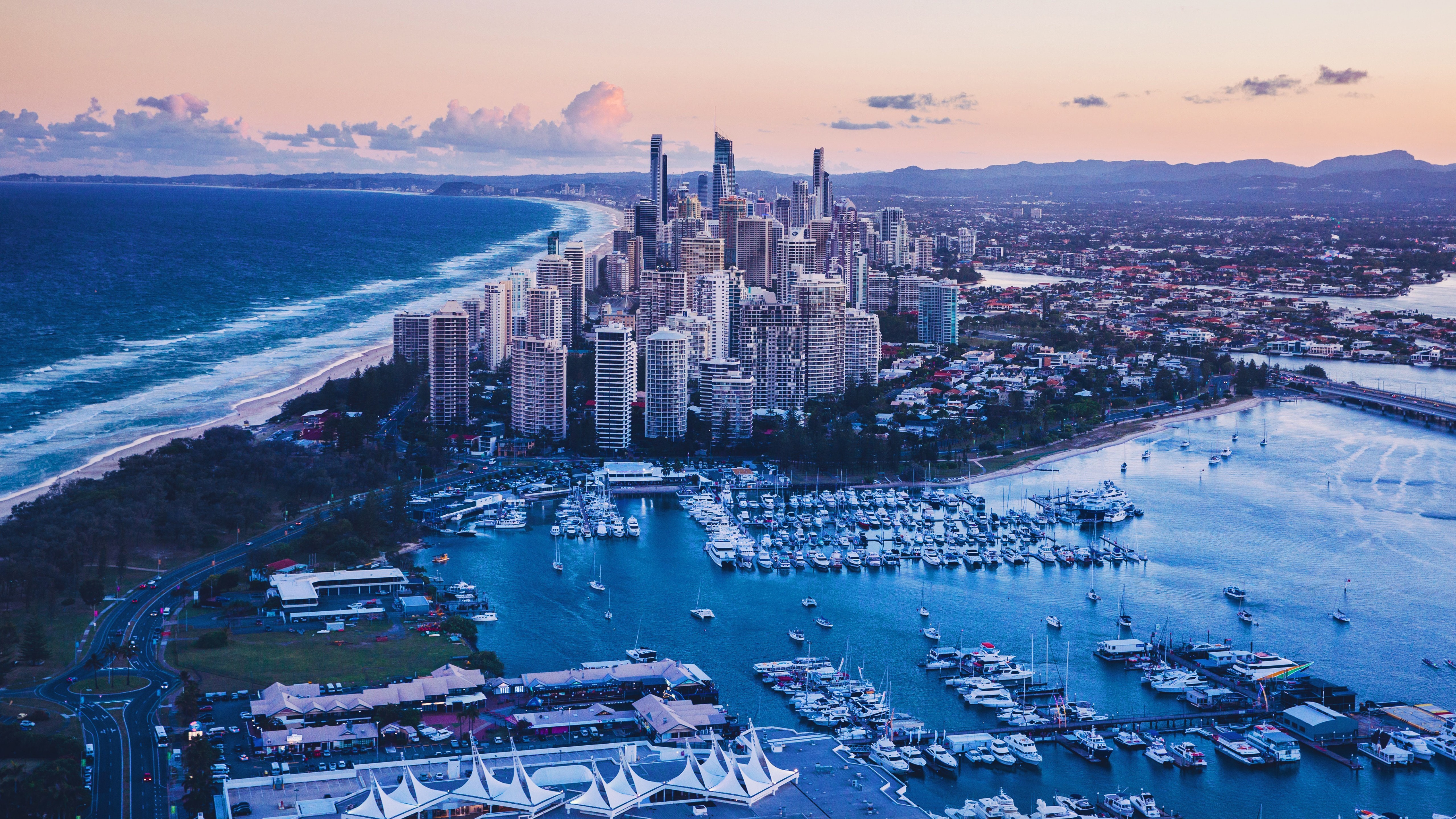 Aerial view of Gold Coast city skyline and marina at sunset HD Wallpaper