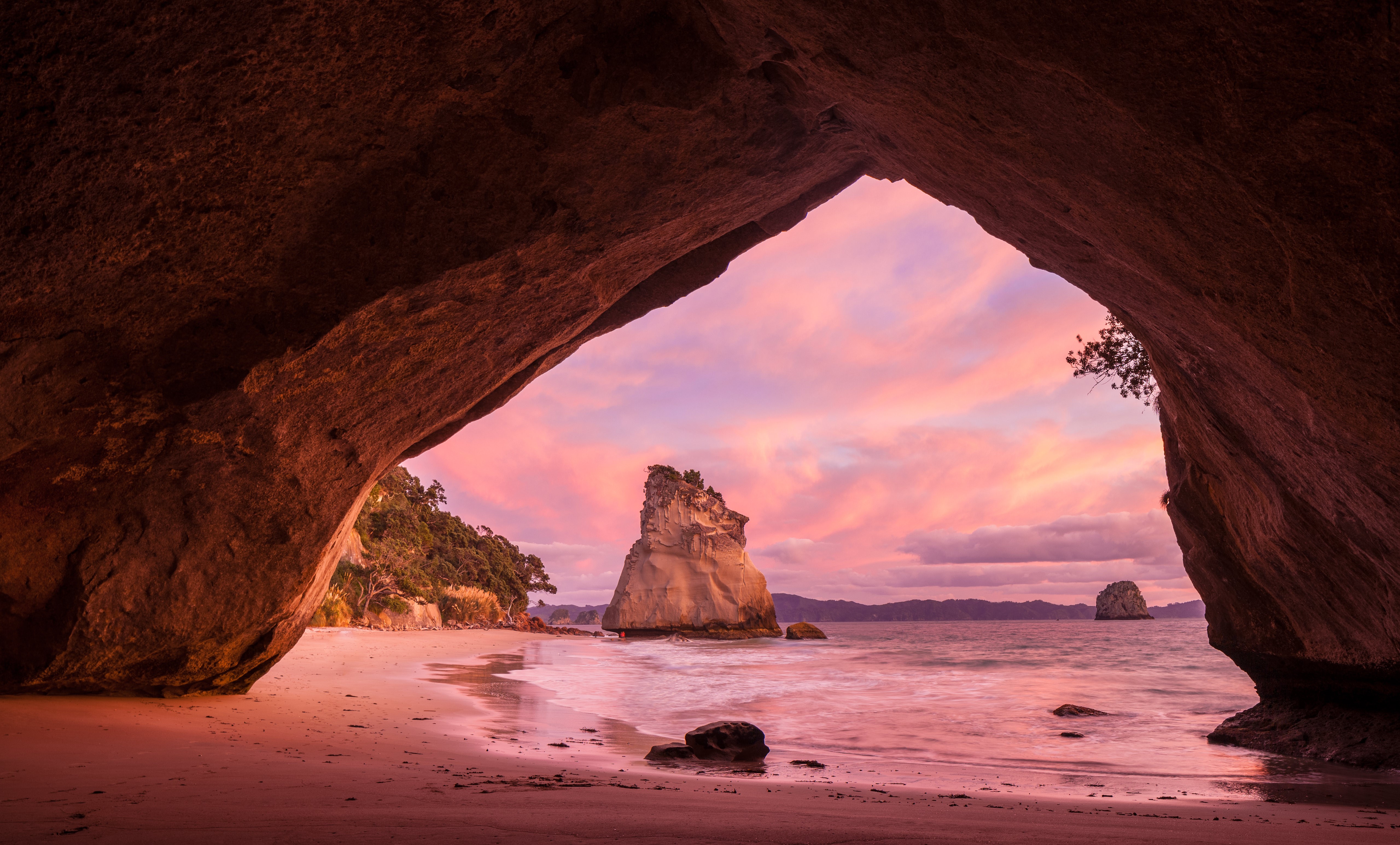 Cave entrance overlooking Cathedral Cove at sunset, New Zealand HD Wallpaper