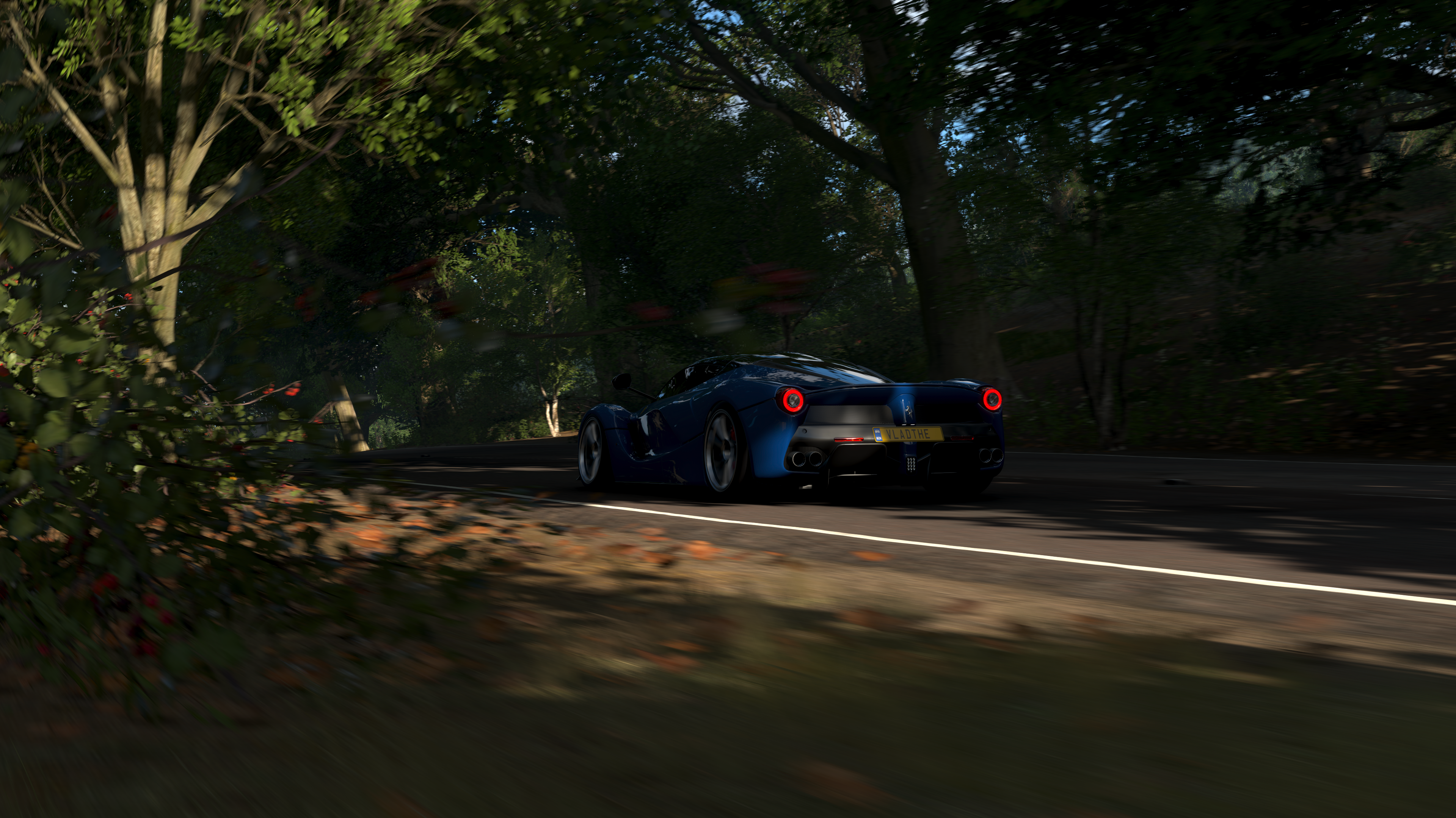 Blue Ferrari driving on a road in Forza Horizon 4 HD Wallpaper
