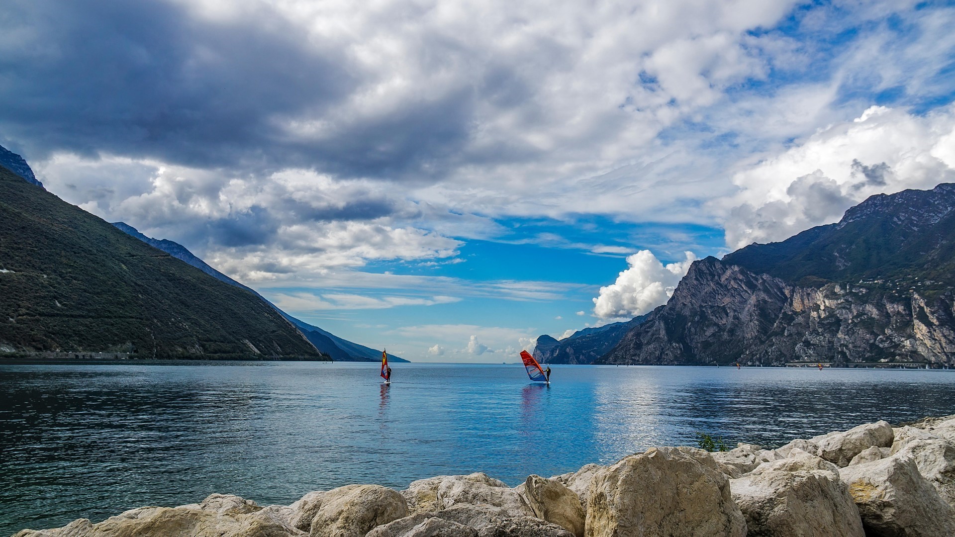 Windsurfers on Lake Garda with Mountains and Clouds HD Wallpaper