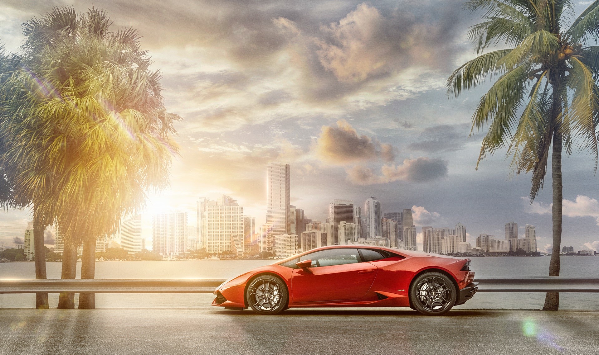 Red Lamborghini Huracan in a Cityscape with Palm Trees HD Wallpaper
