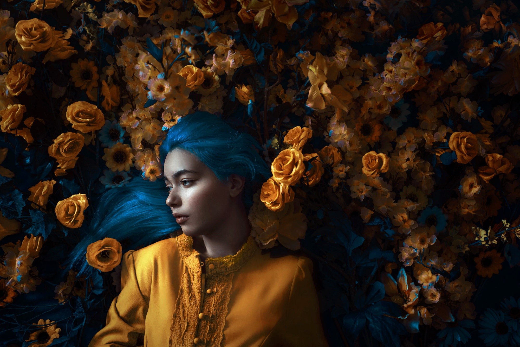 Woman with blue hair lying in yellow and blue flowers HD Wallpaper