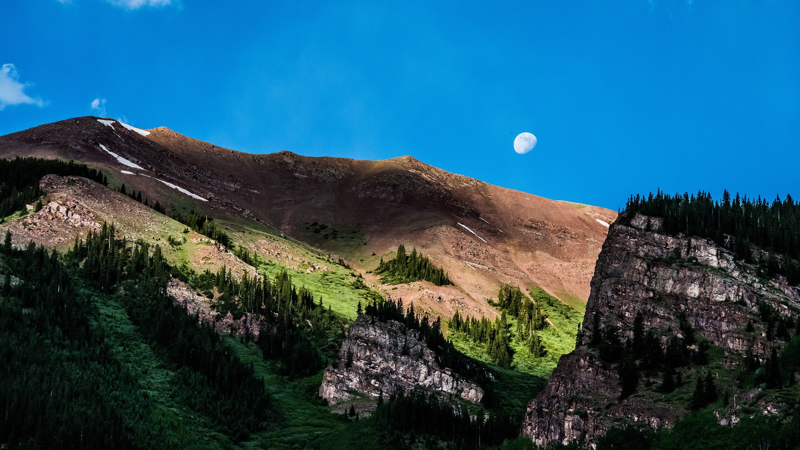 Mountains with moon and trees under blue sky HD Wallpaper
