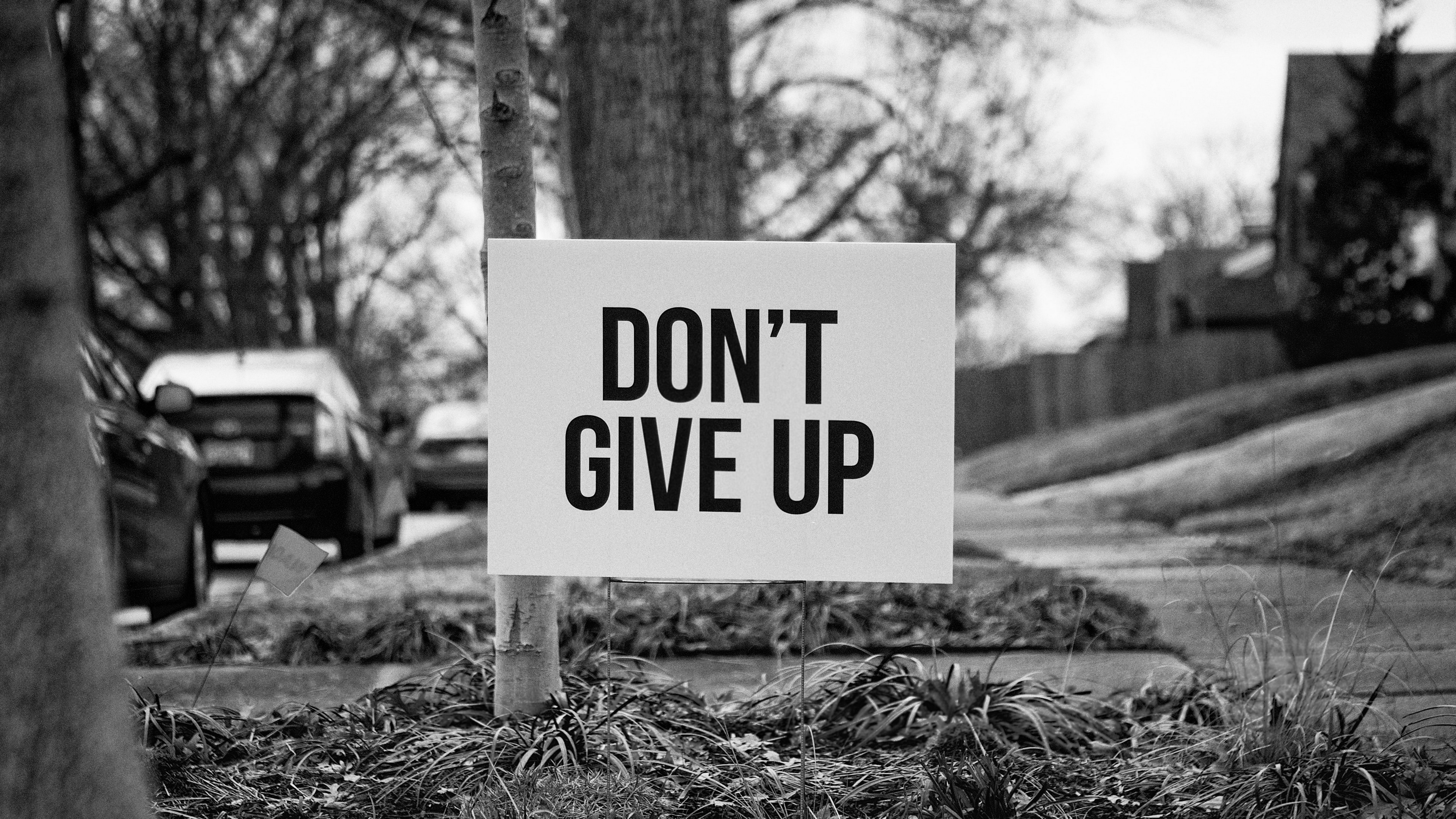 Sign with "DON'T GIVE UP" text HD Wallpaper